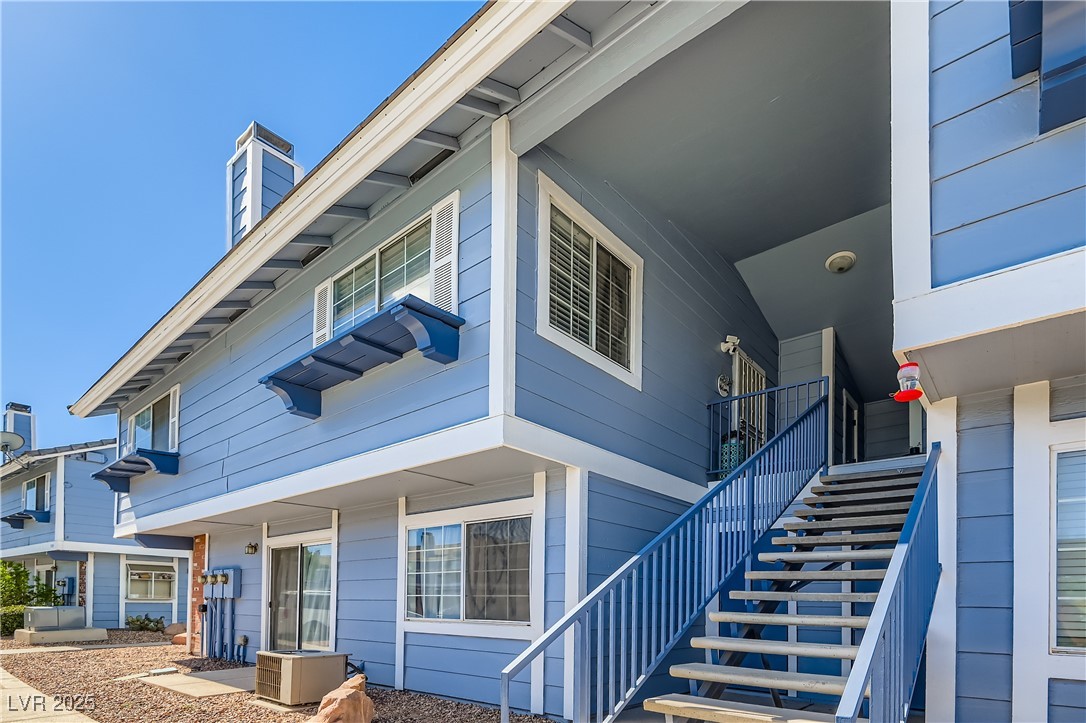 5355 Angler Circle, Unit 202 Las Vegas, NV 89122 - Photo 3 of 28 View of home's exterior with stairway and a chimney