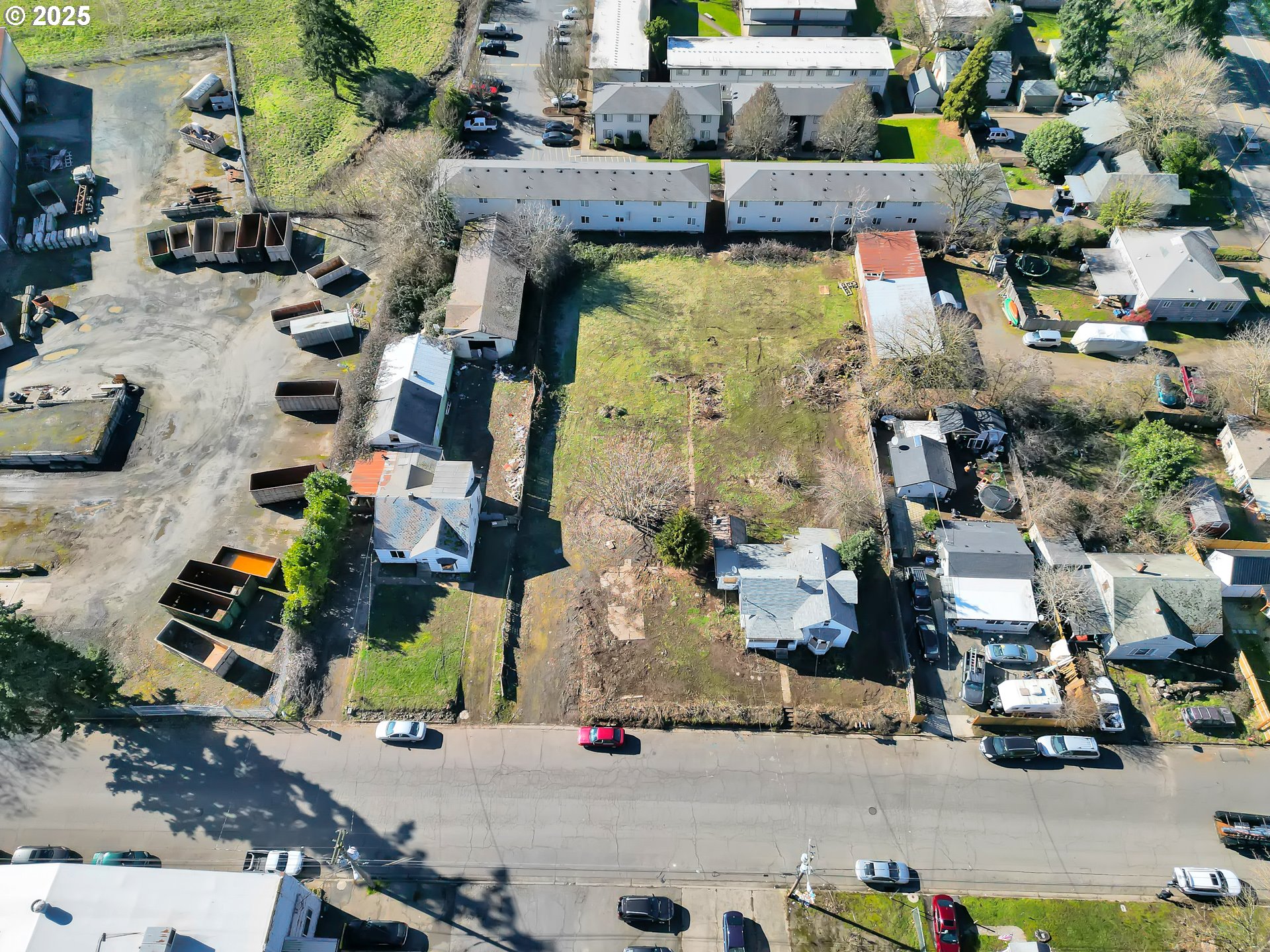 an aerial view of houses with outdoor space