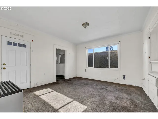 a view of an empty room with a window