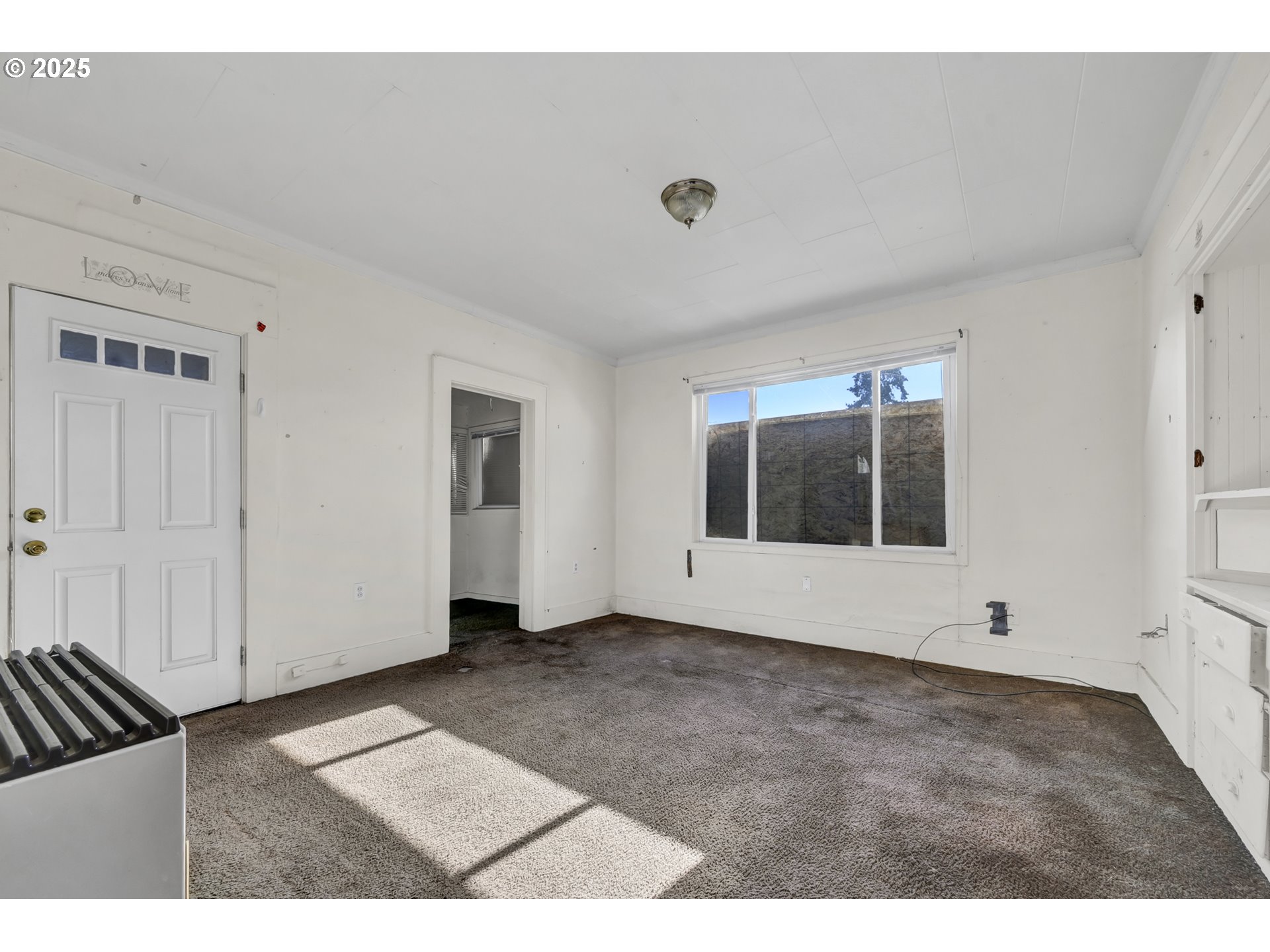 168 North Cleveland Street Eugene, OR 97402 - Photo 6 of 40 a view of an empty room with a window