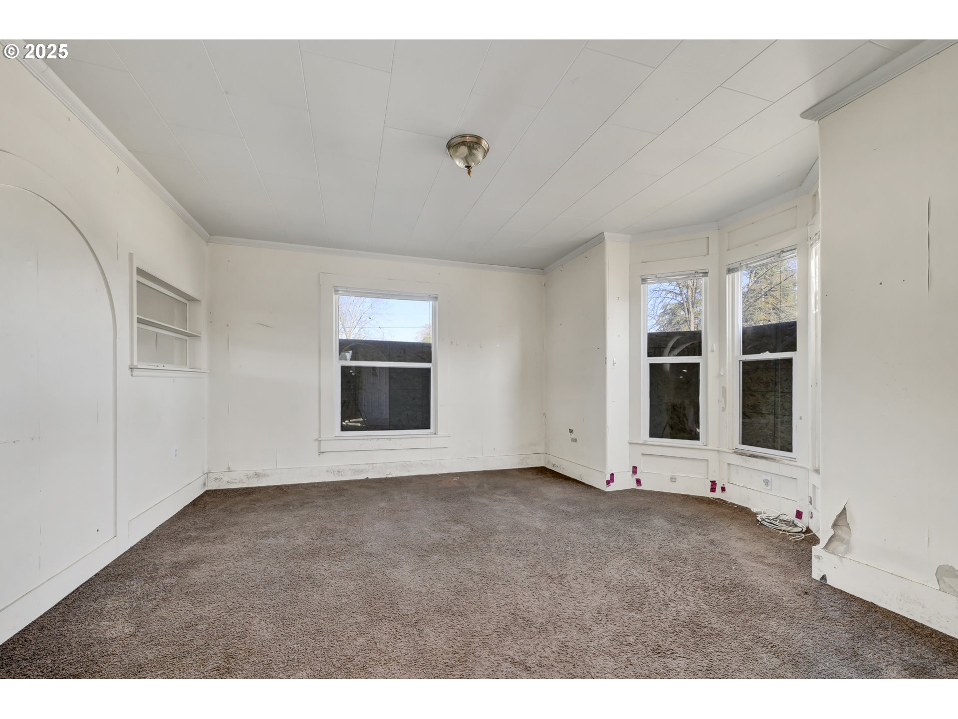 168 North Cleveland Street Eugene, OR 97402 - Photo 7 of 40 a view of an empty room with a window