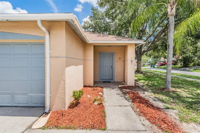 a front view of house with yard and green space