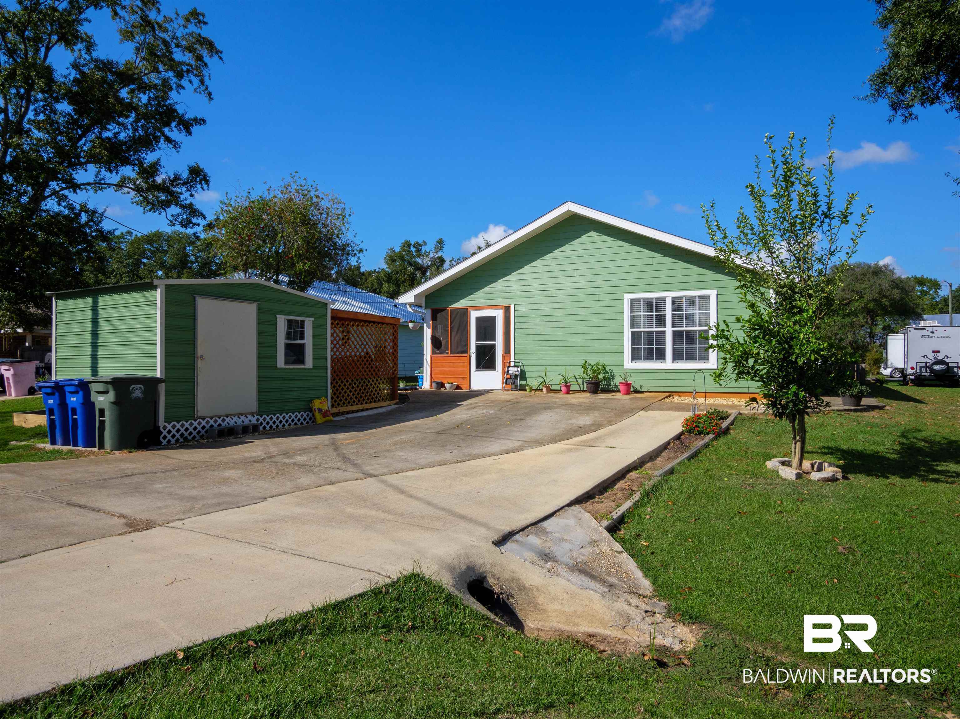 709 West Marigold Avenue Foley, AL 36535 - Photo 20 of 26 Shed is behind home to side of driveway