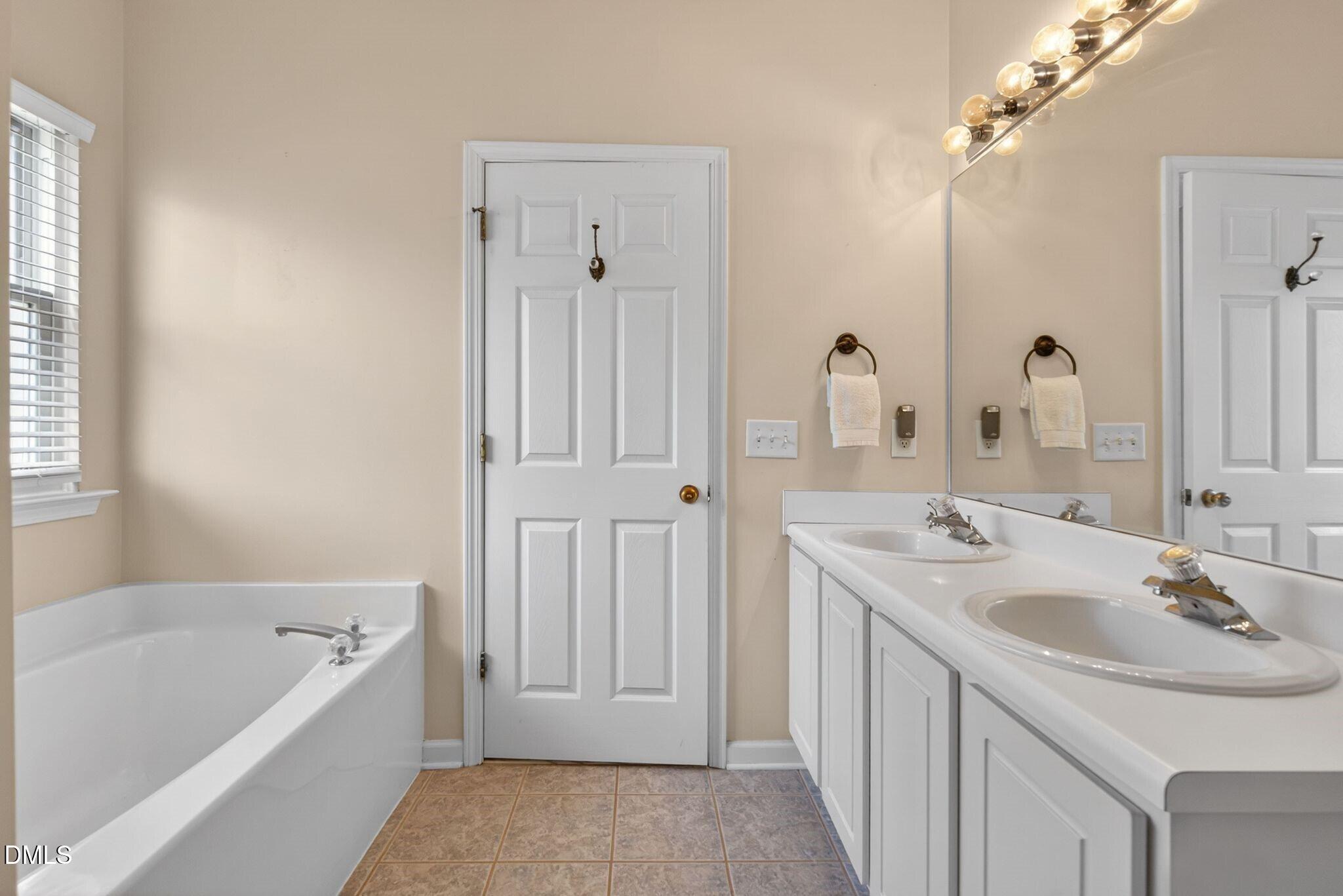 3113 Locust Grove Drive Apex, NC 27539 - Photo 20 of 39 020_48_019primarybathroom