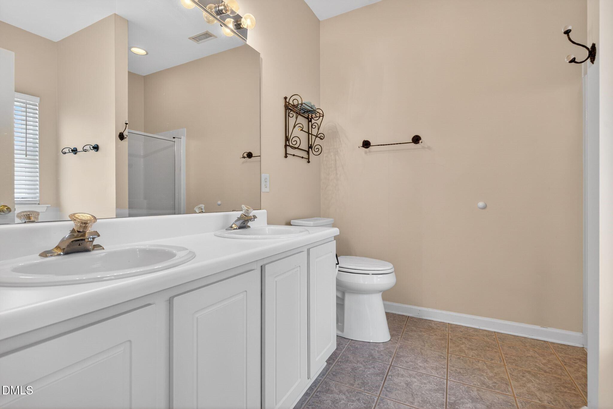 3113 Locust Grove Drive Apex, NC 27539 - Photo 22 of 39 022_50_021primarybathroom
