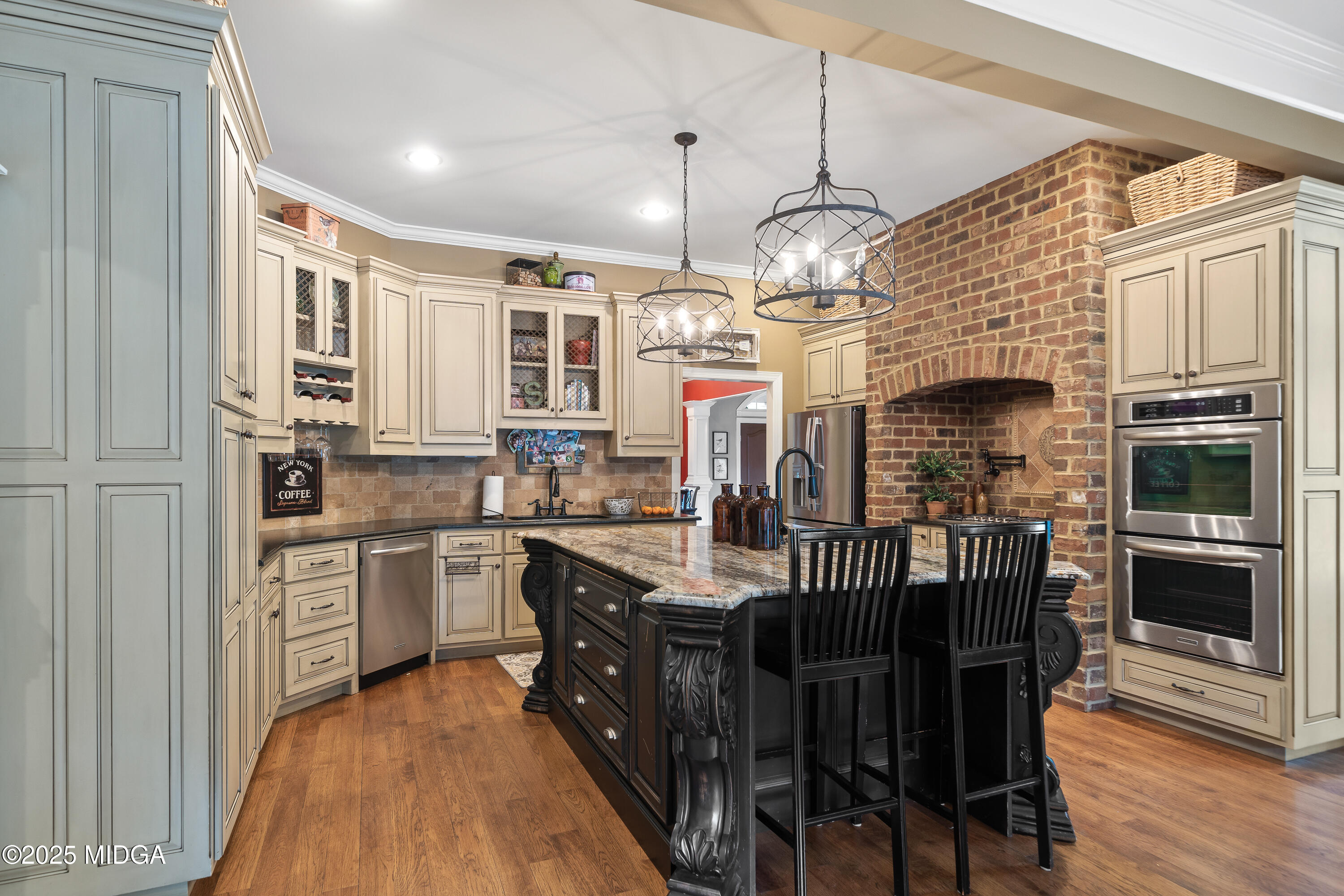 415 Irongate Macon, GA 31220 - Photo 11 of 56 a kitchen with stainless steel appliances granite countertop a stove top oven a sink dishwasher and wooden cabinets