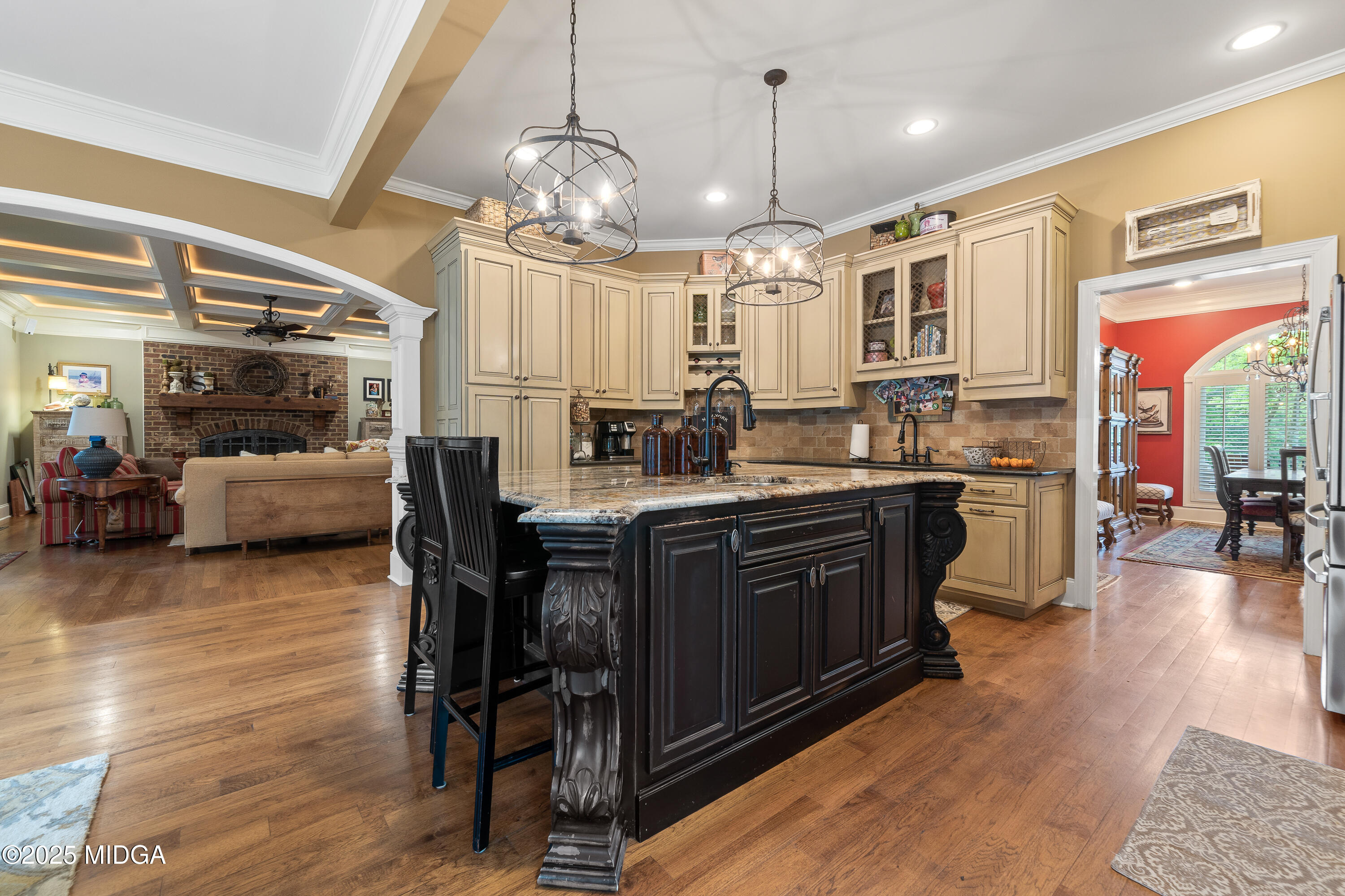 415 Irongate Macon, GA 31220 - Photo 16 of 56 a kitchen with stainless steel appliances granite countertop a stove a refrigerator a kitchen island a dining table and chairs with wooden floor