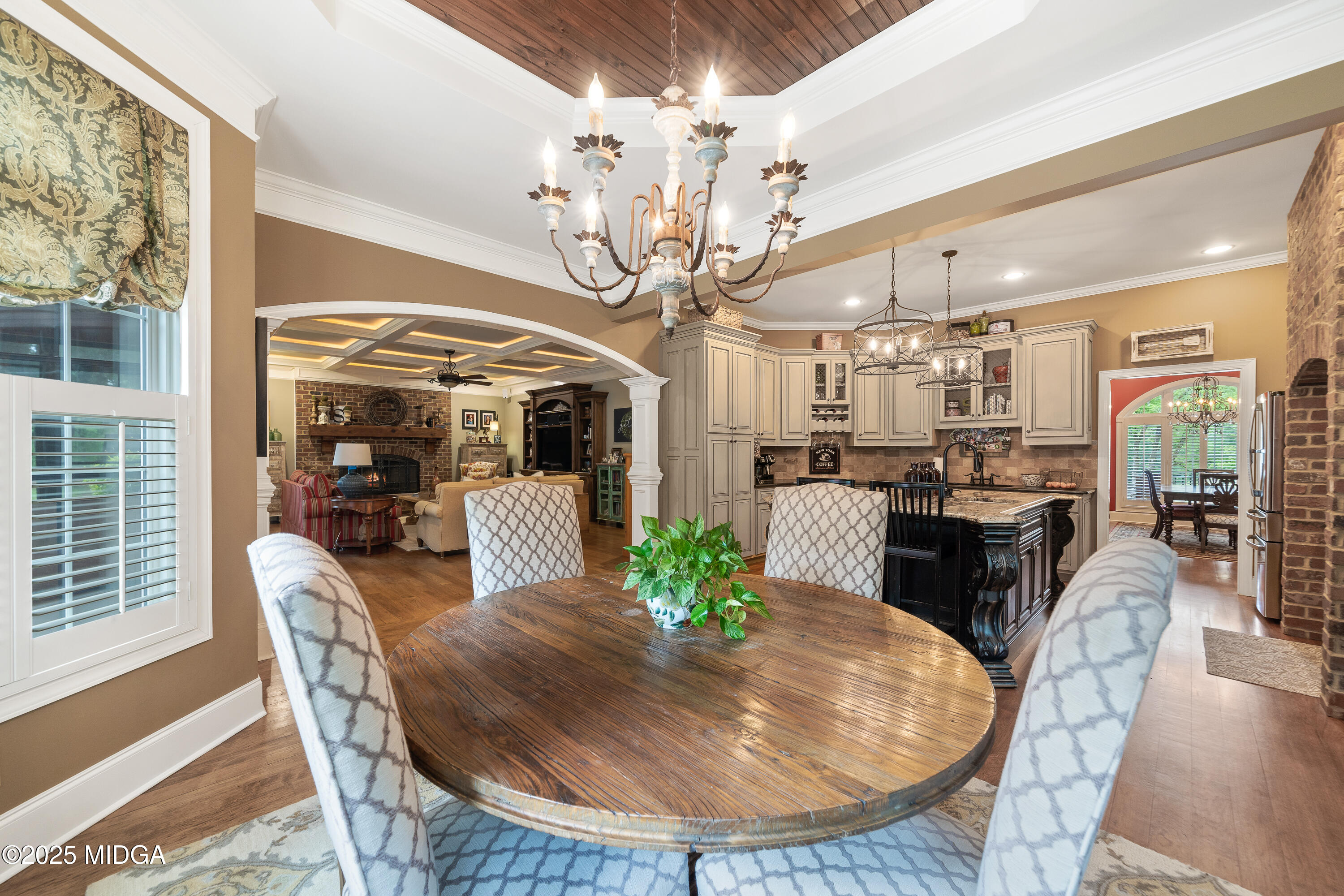 415 Irongate Macon, GA 31220 - Photo 19 of 56 a view of a dining room with furniture a chandelier and wooden floor
