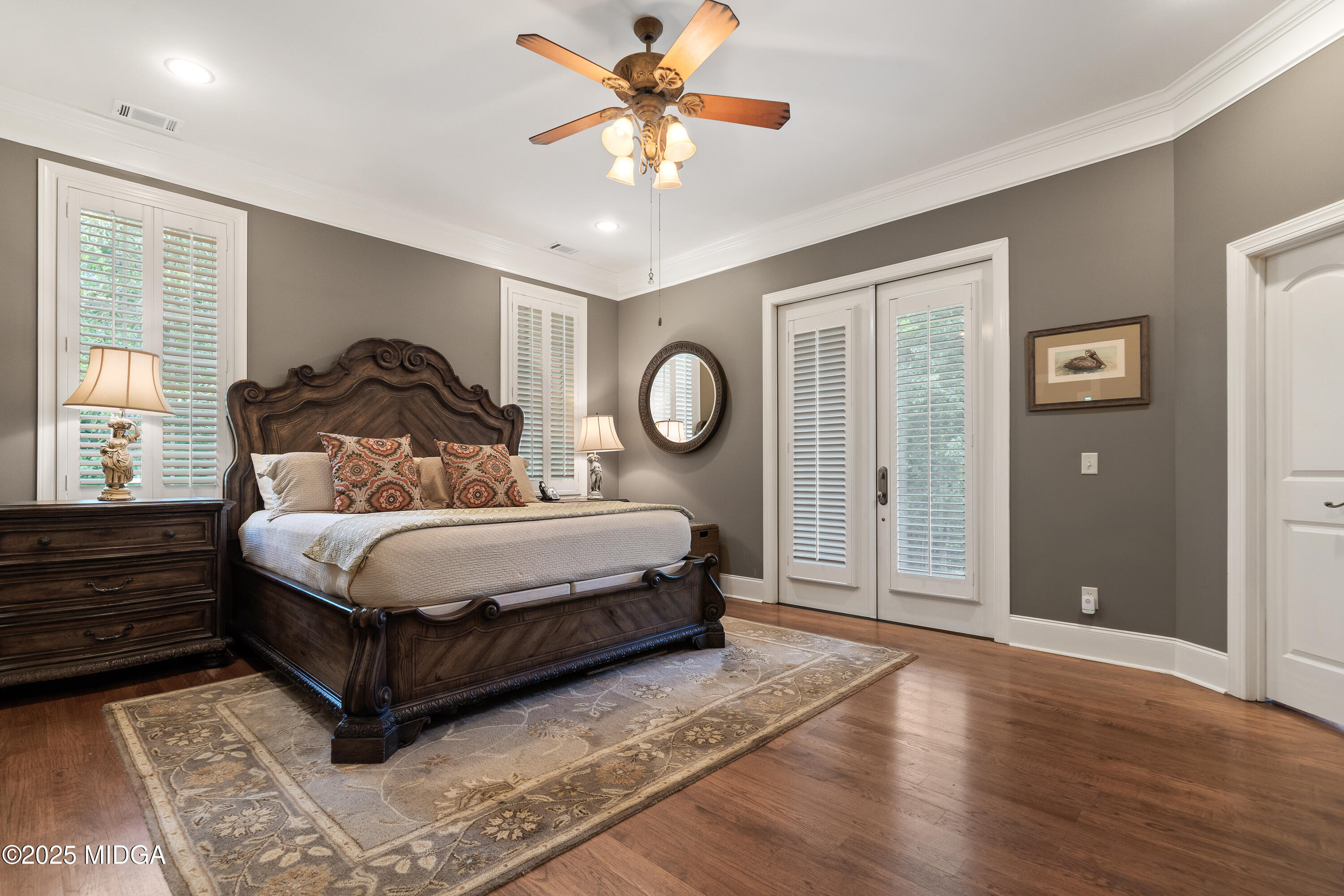 415 Irongate Macon, GA 31220 - Photo 27 of 56 a bedroom with a bed and a chandelier