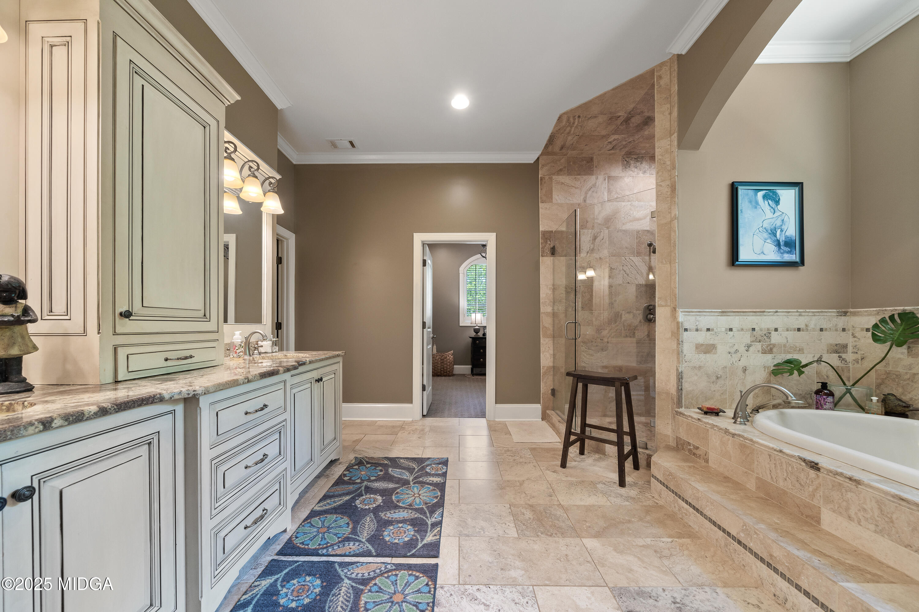 415 Irongate Macon, GA 31220 - Photo 30 of 56 a spacious bathroom with a double vanity sink a mirror and a bathtub