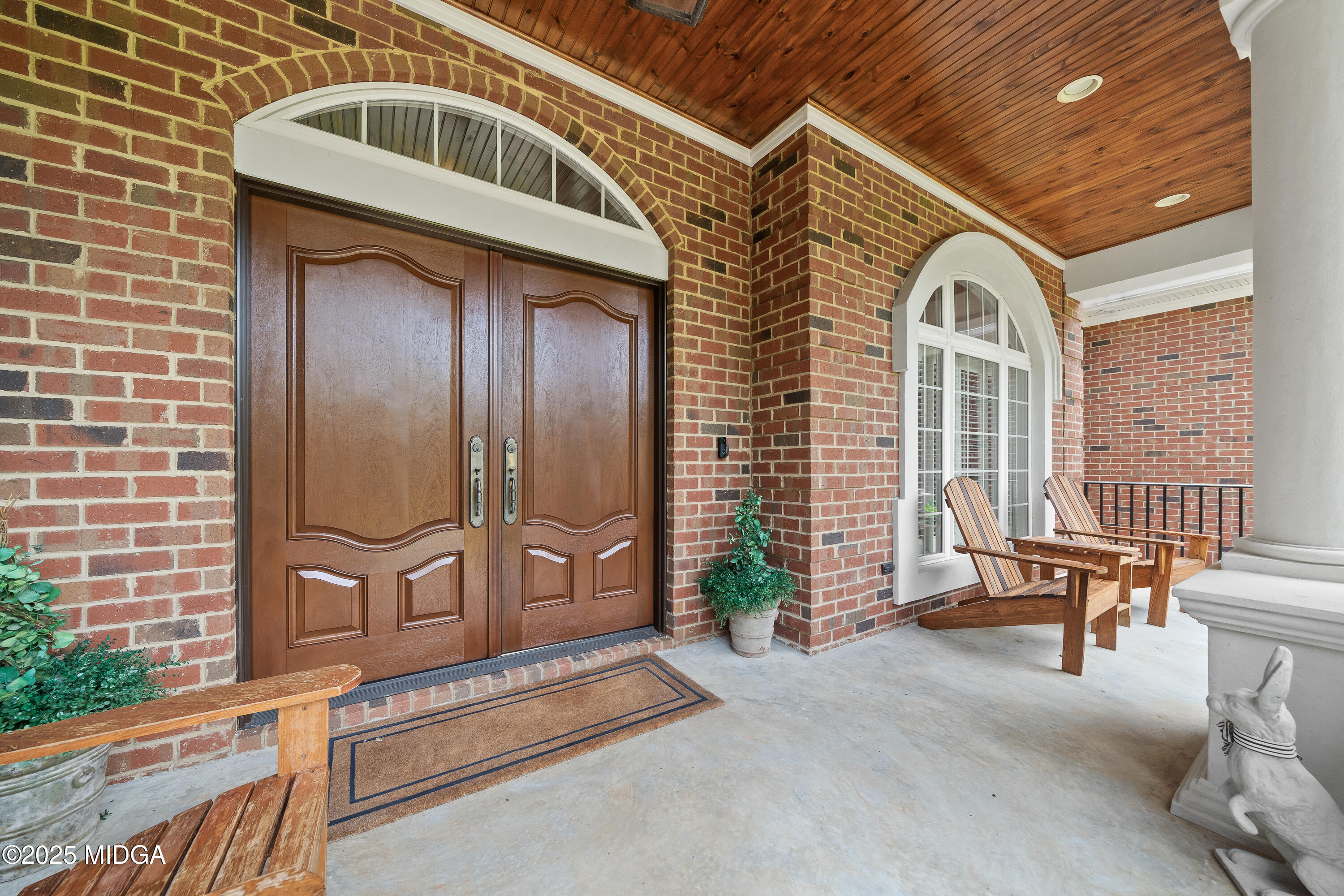 415 Irongate Macon, GA 31220 - Photo 3 of 56 a front view of a house with entryway and wooden walls