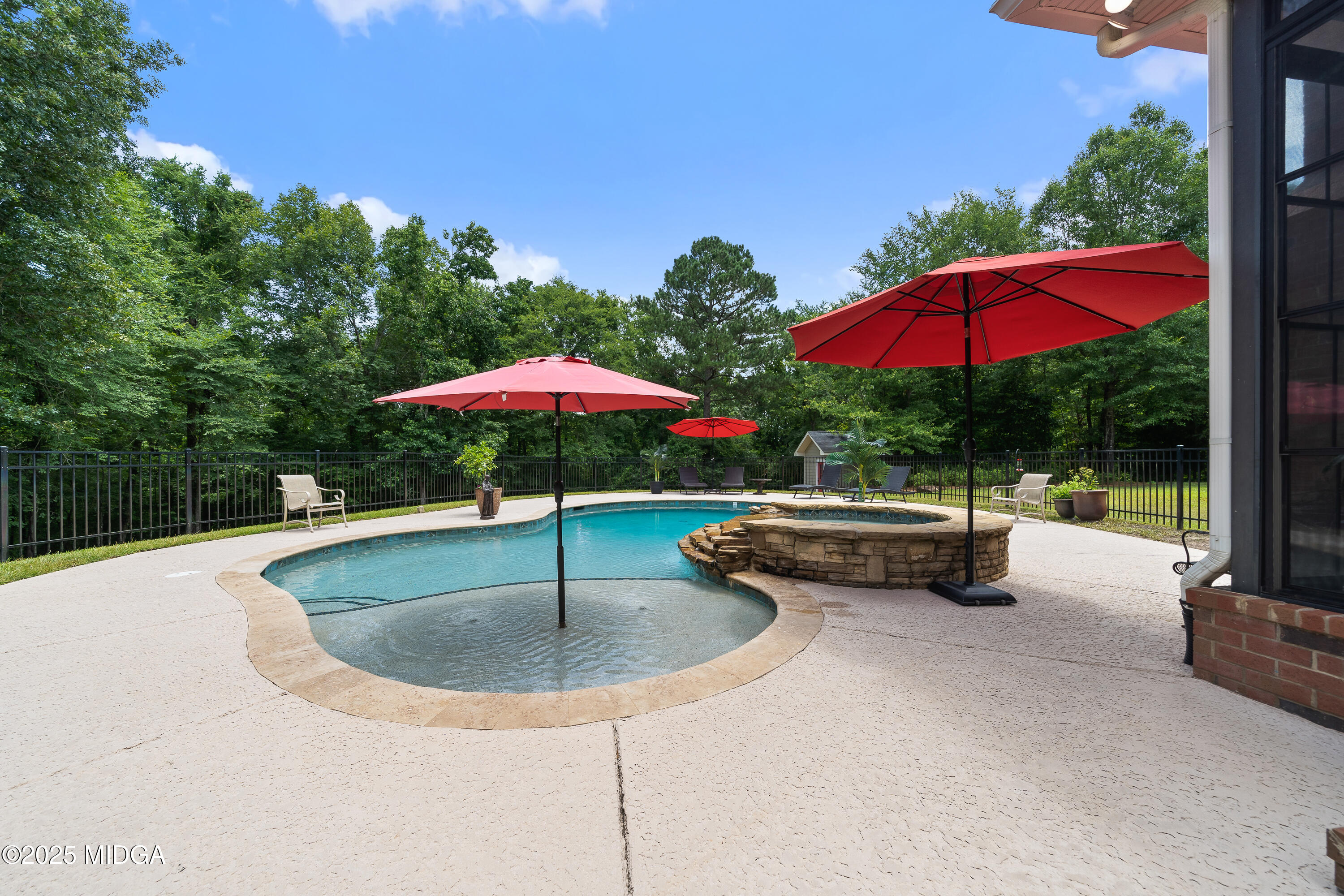 415 Irongate Macon, GA 31220 - Photo 48 of 56 a view of pool with table and chairs under an umbrella