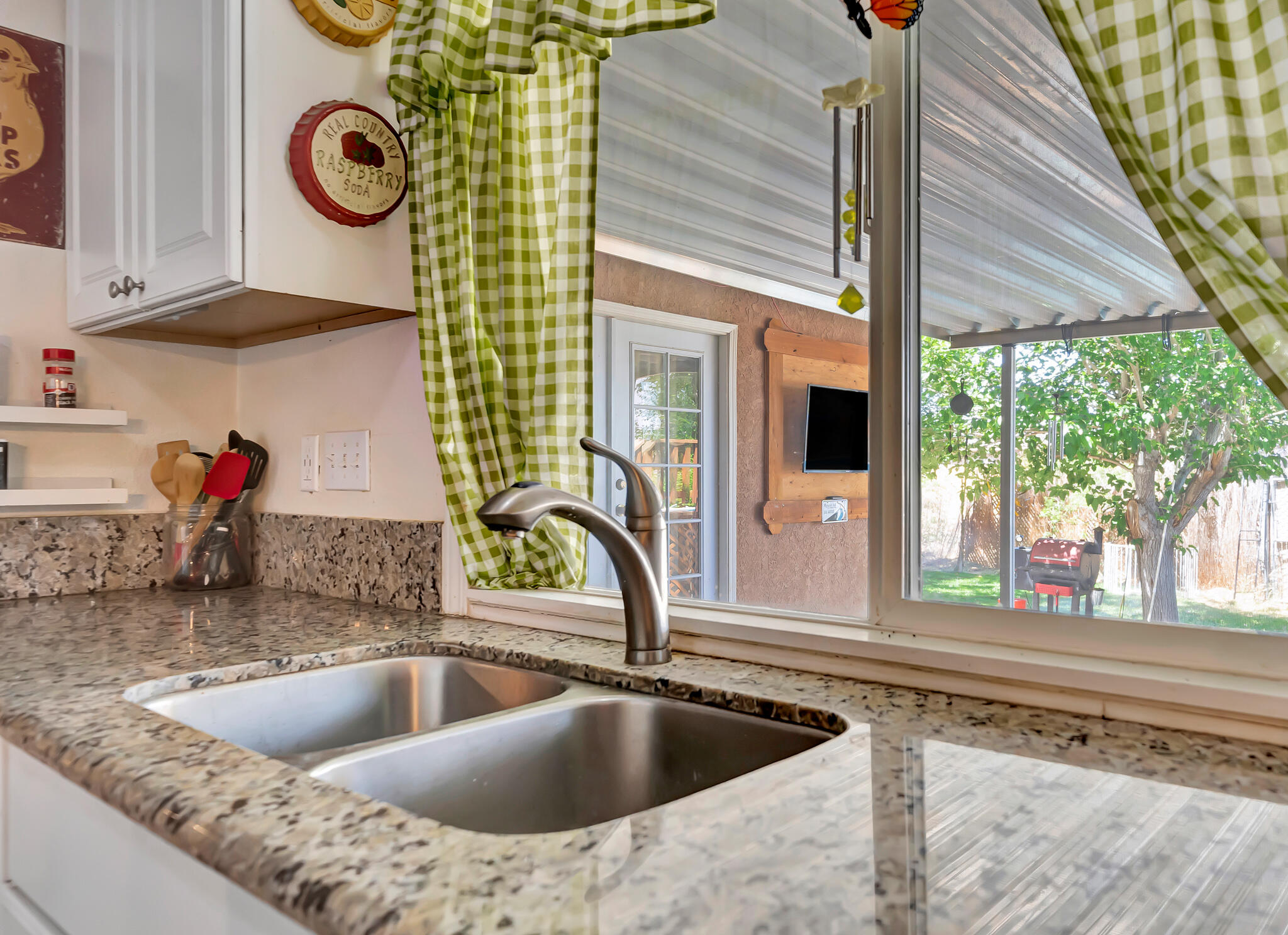 209 North Sunland Drive Ridgecrest, CA 93555 - Photo 12 of 51 a kitchen with a sink and a large window