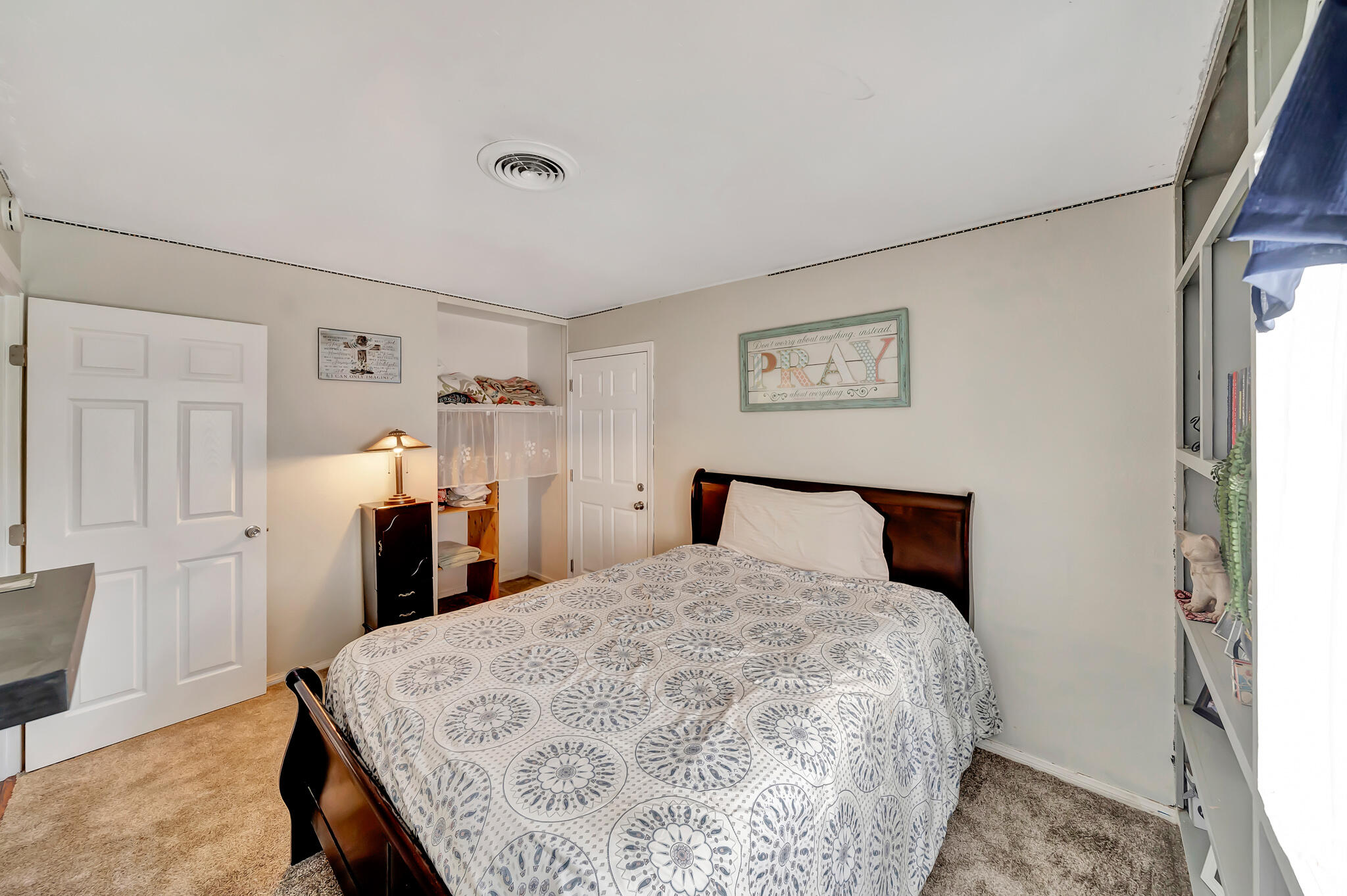 209 North Sunland Drive Ridgecrest, CA 93555 - Photo 20 of 51 a bed room with a bed and a chair