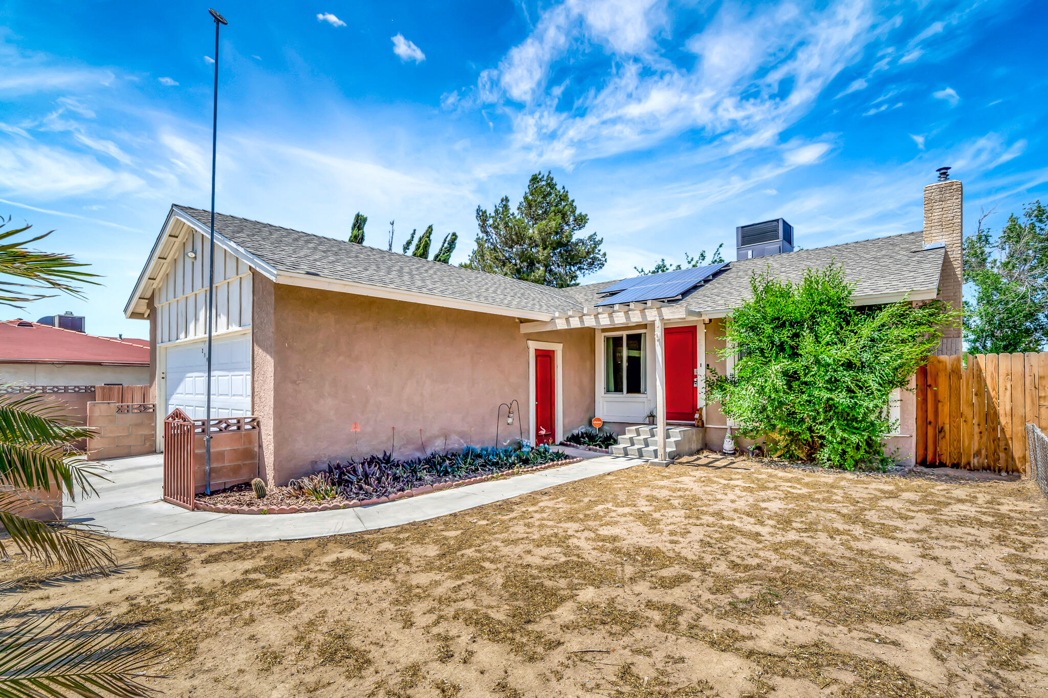 209 North Sunland Drive Ridgecrest, CA 93555 - Photo 2 of 51 a view of a house with a yard