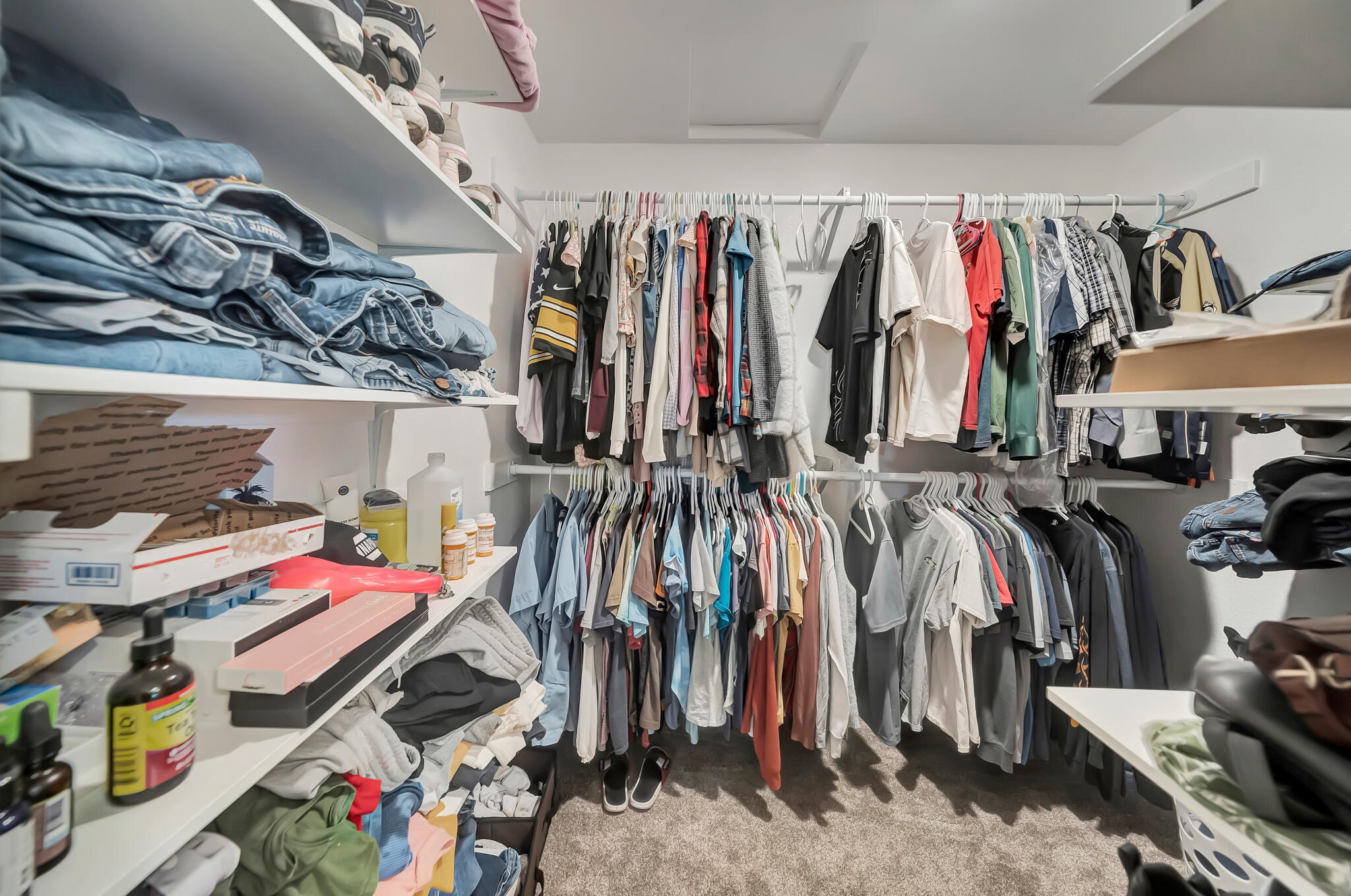 209 North Sunland Drive Ridgecrest, CA 93555 - Photo 23 of 51 a view of walk in closet with clothes and shoes