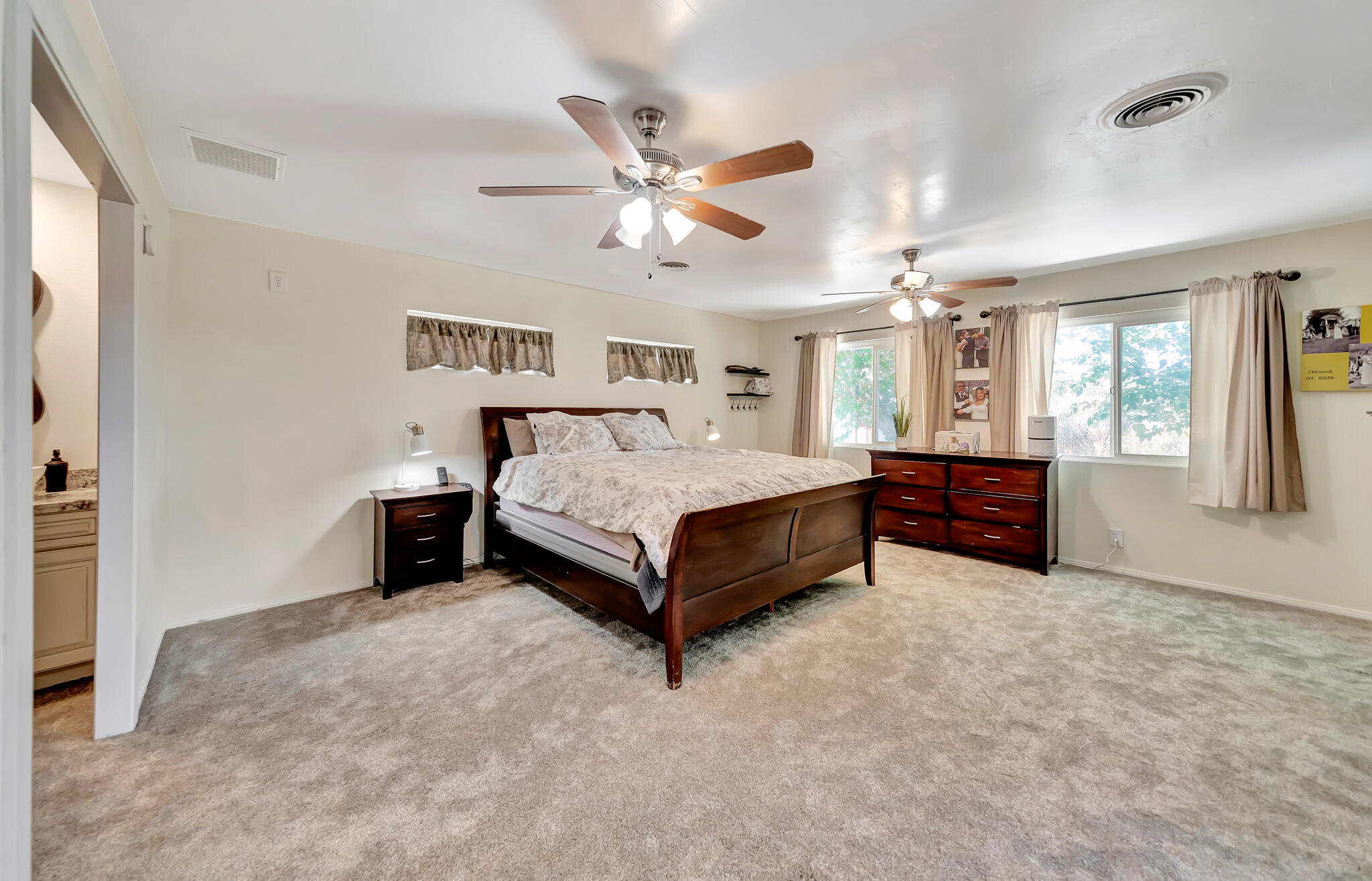 209 North Sunland Drive Ridgecrest, CA 93555 - Photo 28 of 51 a bedroom with a bed and window