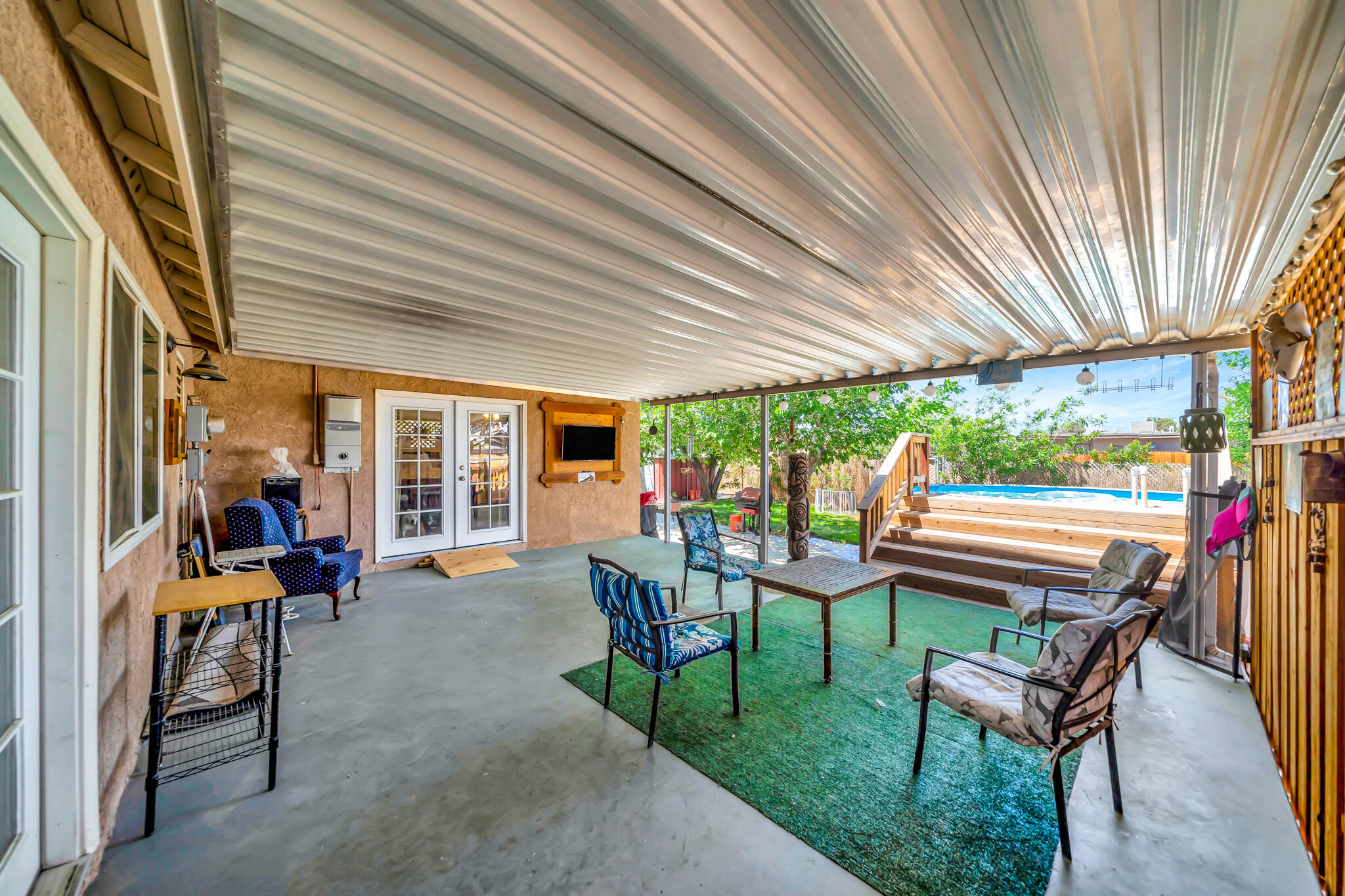 209 North Sunland Drive Ridgecrest, CA 93555 - Photo 36 of 51 a view of a patio with chairs and tables