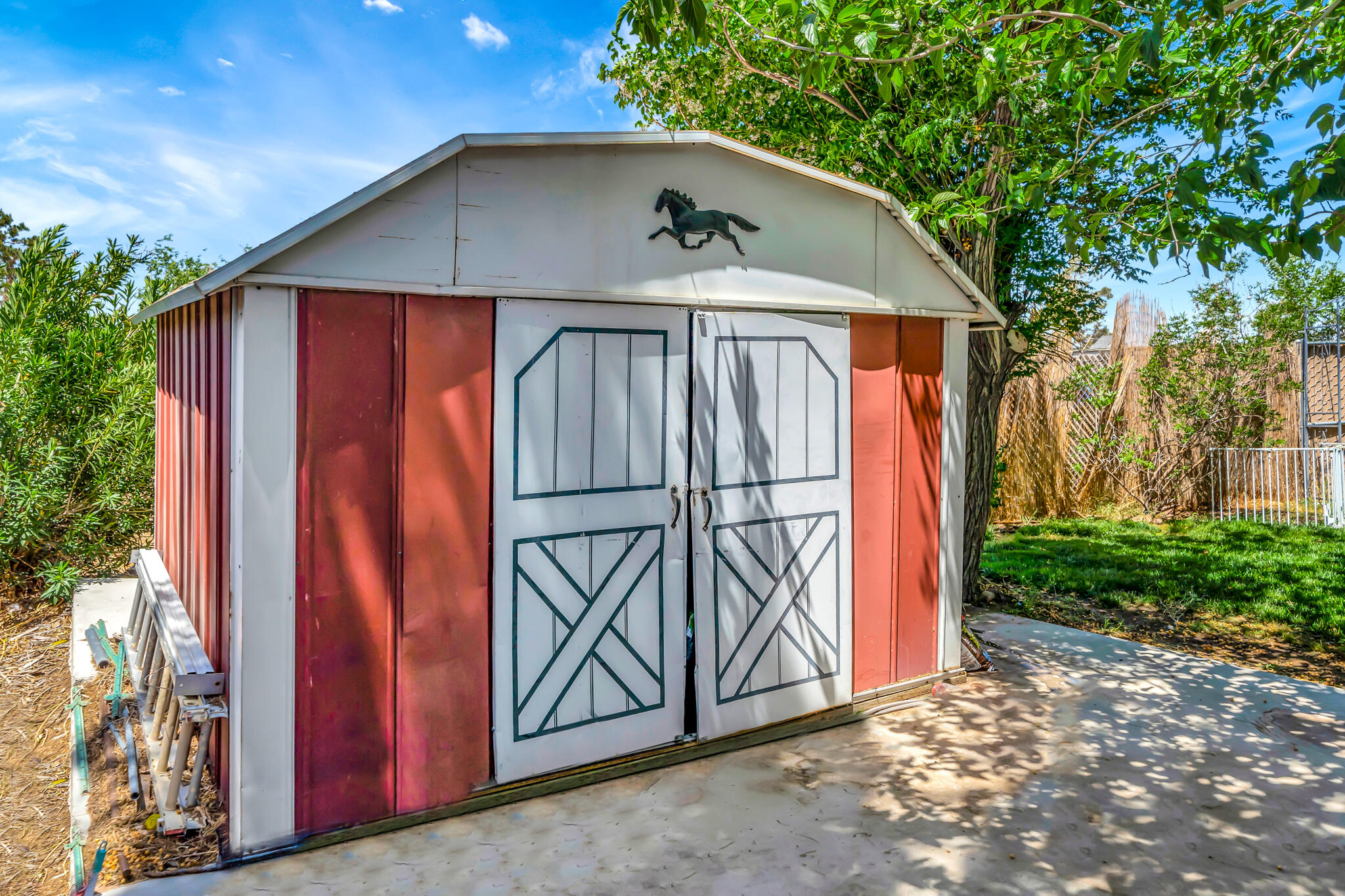 209 North Sunland Drive Ridgecrest, CA 93555 - Photo 40 of 51 a view of wooden house with a sink and yard