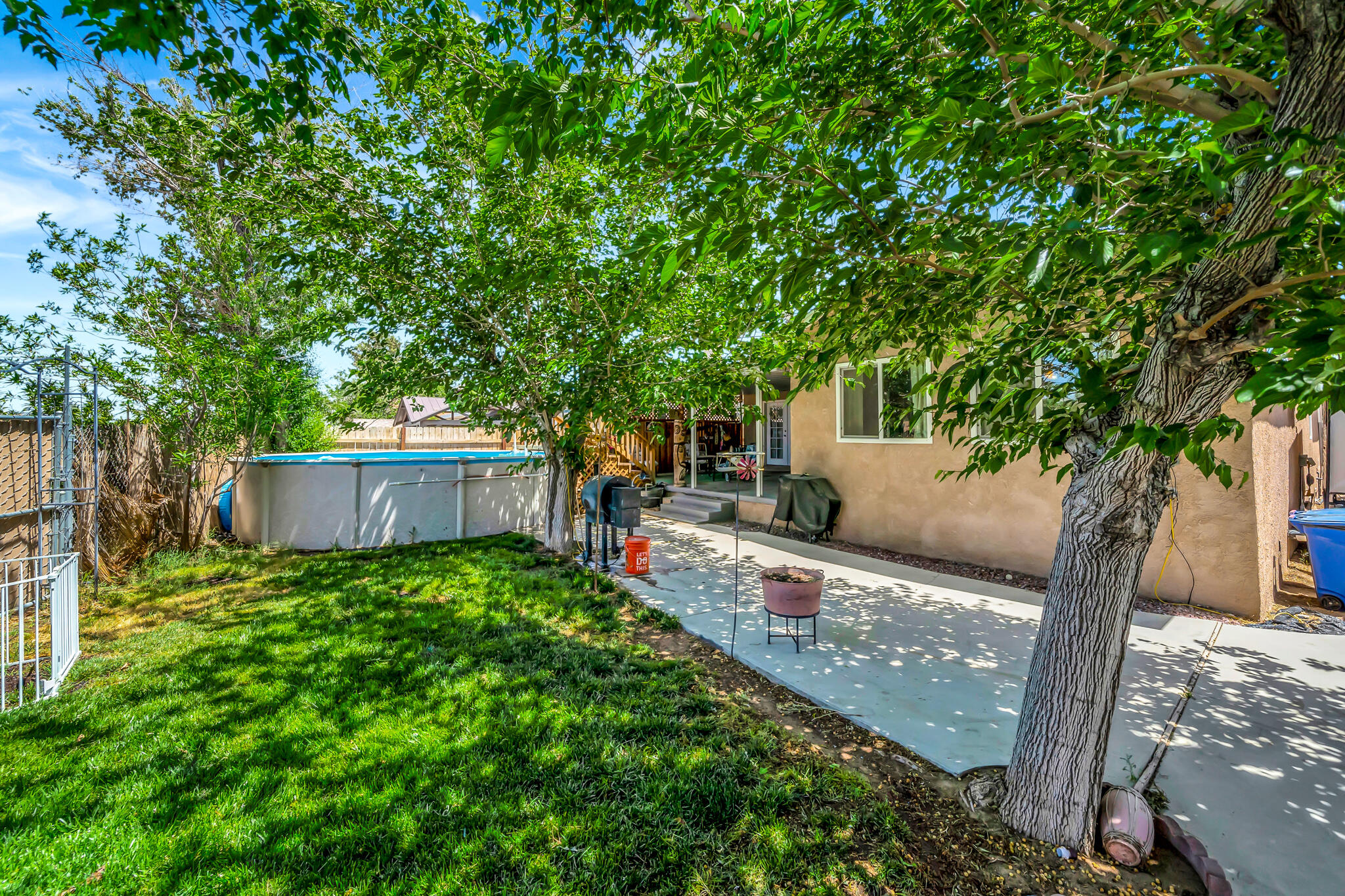 209 North Sunland Drive Ridgecrest, CA 93555 - Photo 42 of 51 a view of a house with a tree in the background