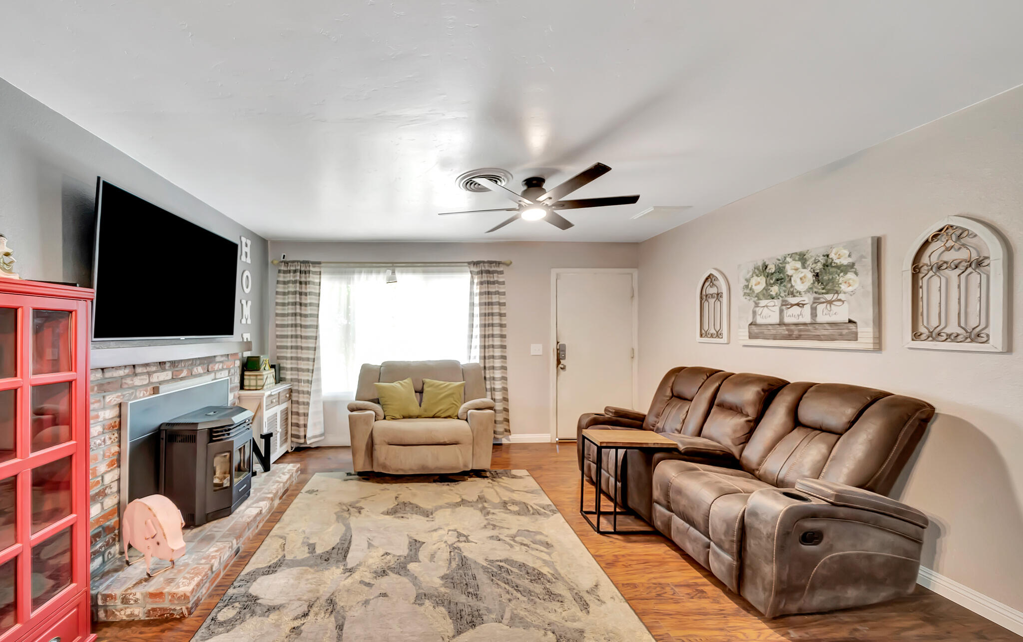 209 North Sunland Drive Ridgecrest, CA 93555 - Photo 5 of 51 a living room with furniture and a flat screen tv