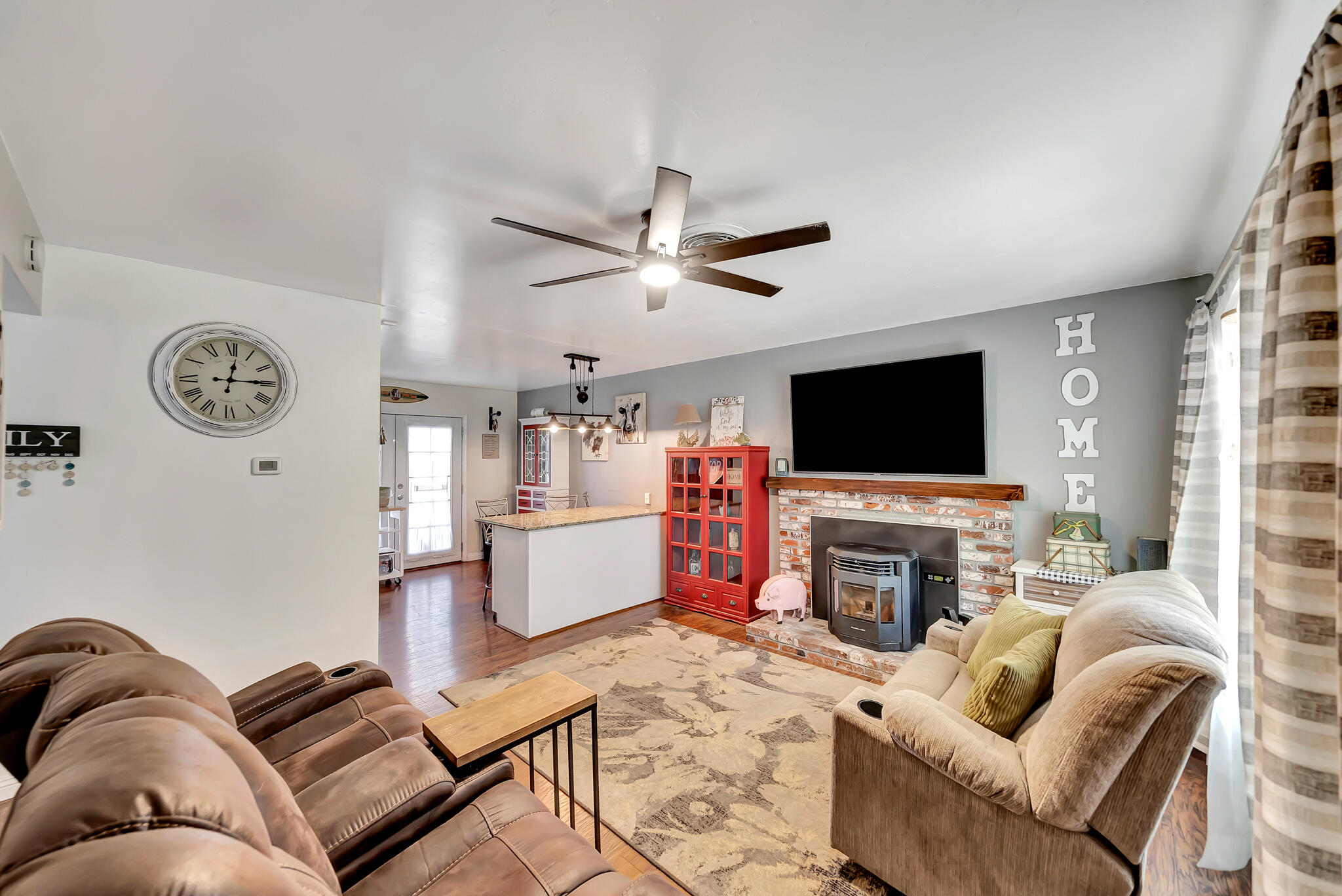 209 North Sunland Drive Ridgecrest, CA 93555 - Photo 6 of 51 a living room with furniture and a flat screen tv