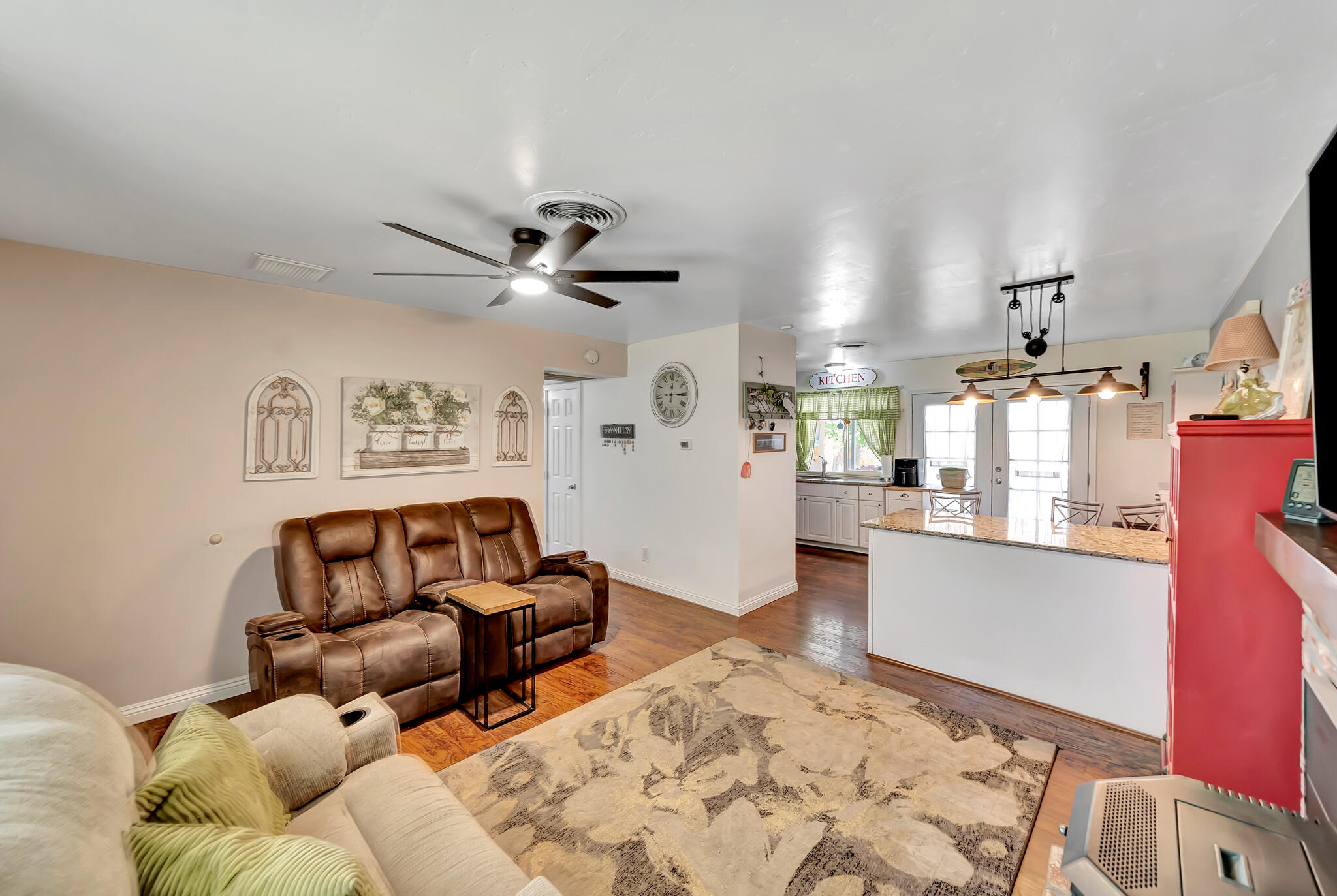 209 North Sunland Drive Ridgecrest, CA 93555 - Photo 7 of 51 a living room with furniture and kitchen view