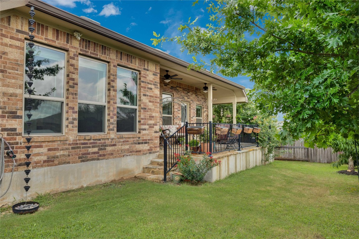 1312 Terrace View Drive Georgetown, TX 78628 - Photo 15 of 40 a view of house with a backyard and a patio