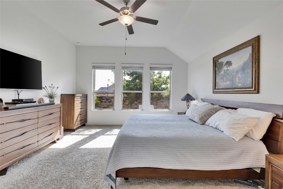 1312 Terrace View Drive Georgetown, TX 78628 - Photo 19 of 40 a bedroom with a bed and a flat screen tv