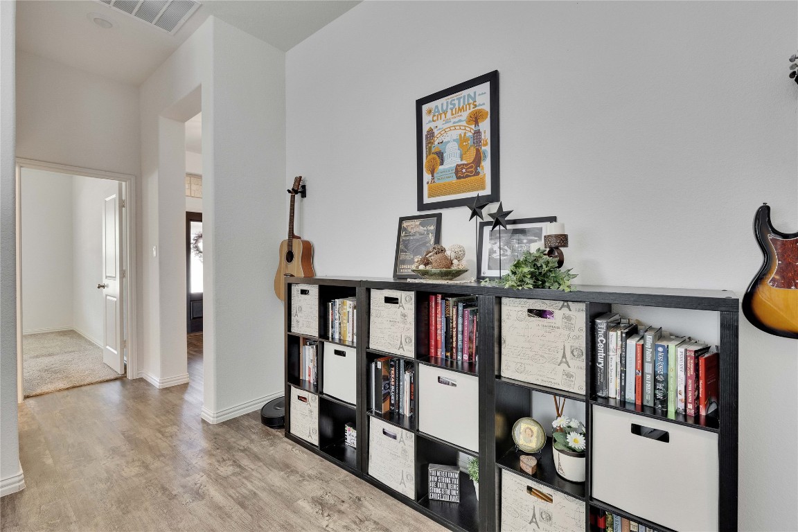 1312 Terrace View Drive Georgetown, TX 78628 - Photo 22 of 40 Game room ready to play games or guitars or reading featuring wood finished floors and baseboards.