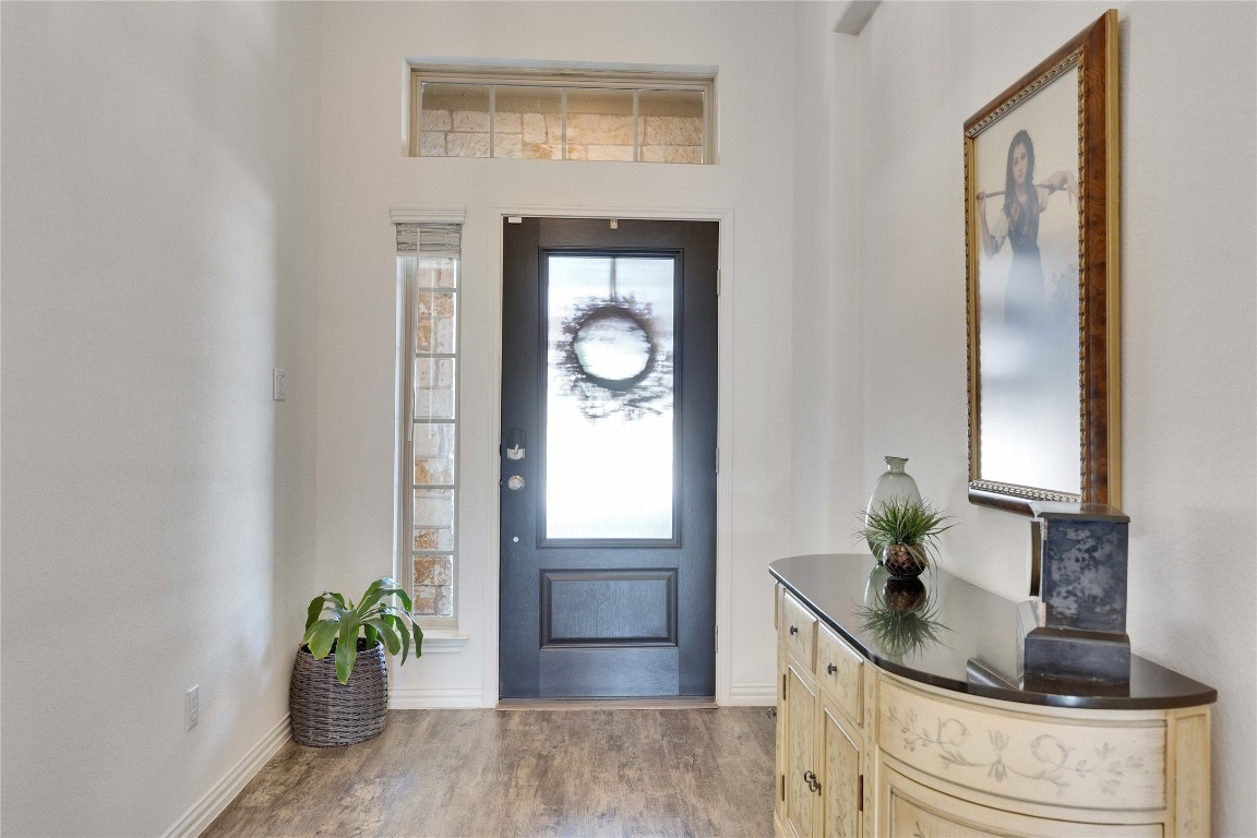 1312 Terrace View Drive Georgetown, TX 78628 - Photo 28 of 40 a potted plant sitting on a dresser next to a window