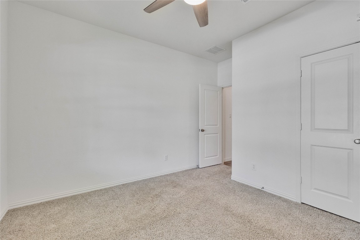 1312 Terrace View Drive Georgetown, TX 78628 - Photo 29 of 40 3rd bedroom carpeted floors and a ceiling fan. Potential exercise room, sewing room, or craft room.