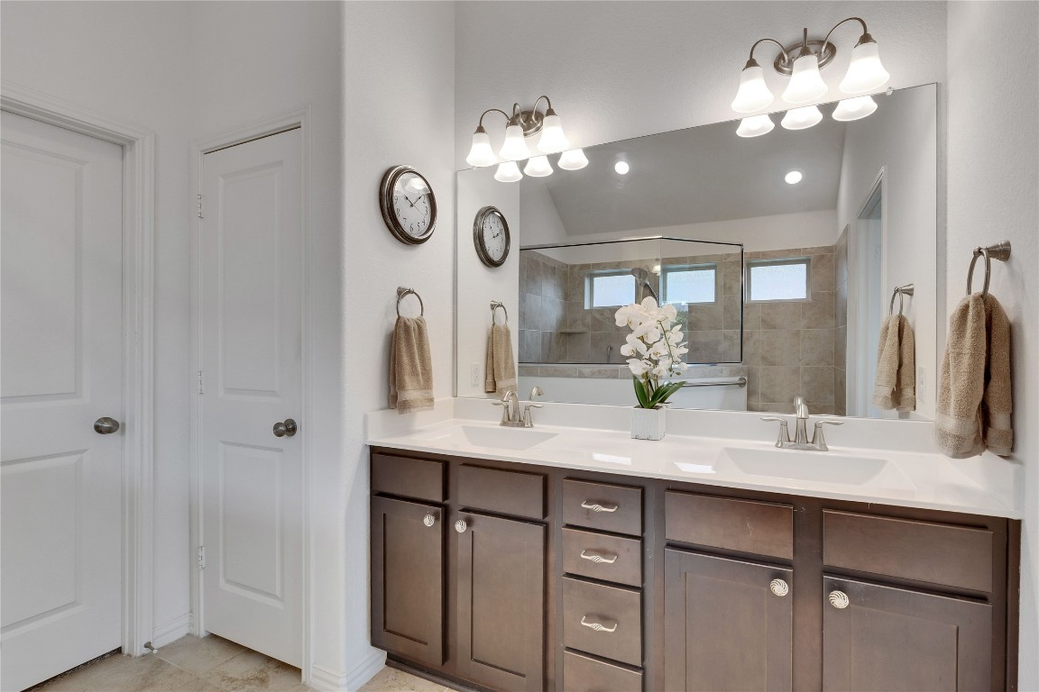 1312 Terrace View Drive Georgetown, TX 78628 - Photo 30 of 40 a bathroom with a sink vanity and a mirror