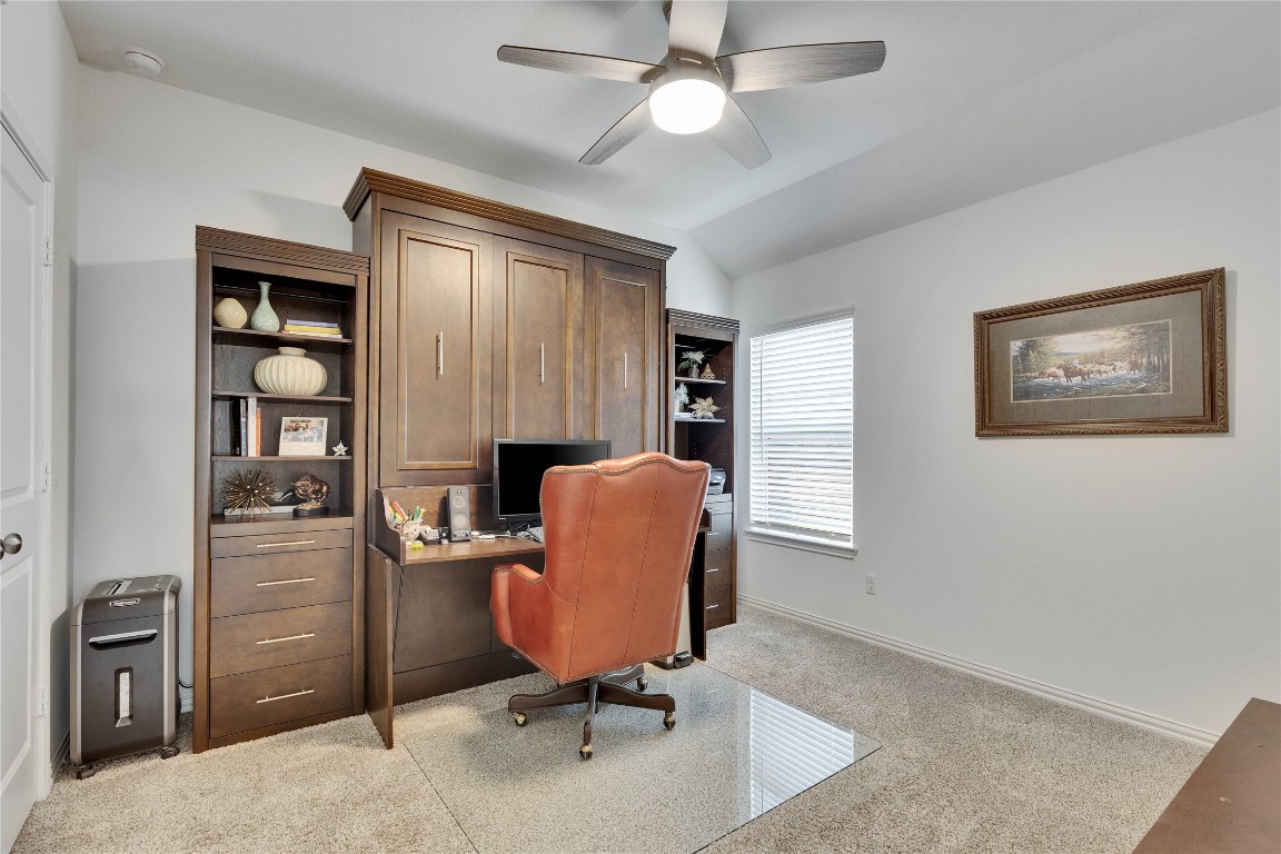 1312 Terrace View Drive Georgetown, TX 78628 - Photo 8 of 40 Office area has a built in Murphy bed that doubles as a desk during the day and bed at night with light colored carpet, a ceiling fan, and vaulted ceiling.