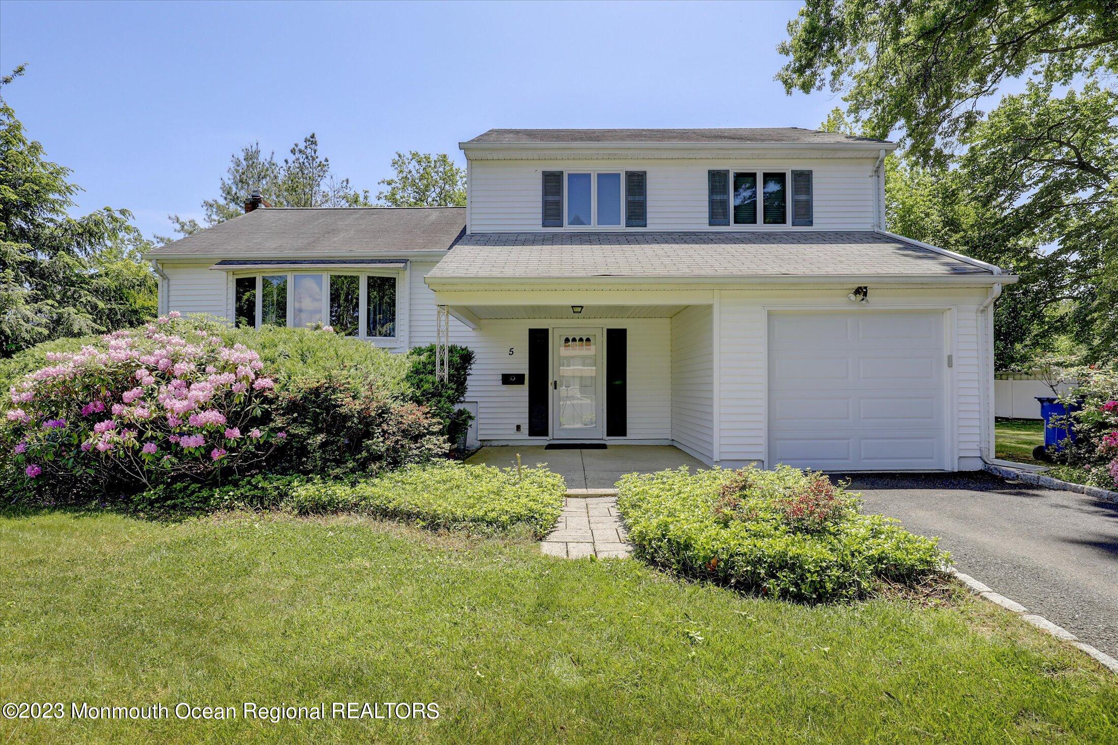 5 Ramble Way Hazlet, NJ 07730 - Photo 1 of 34 a front view of a house with a garden