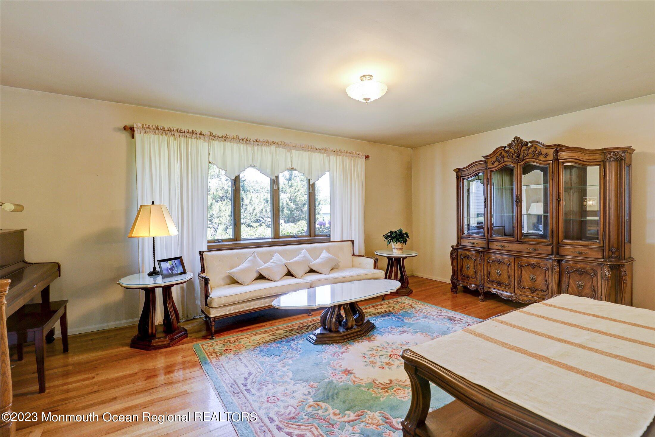 5 Ramble Way Hazlet, NJ 07730 - Photo 11 of 34 a living room with furniture and a flat screen tv
