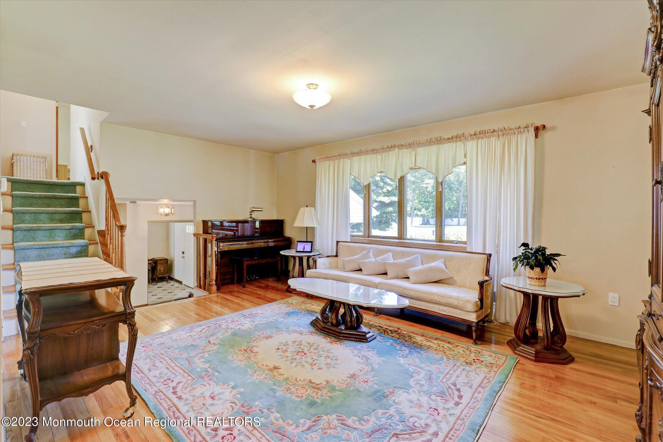 5 Ramble Way Hazlet, NJ 07730 - Photo 12 of 34 a living room with furniture and a fireplace