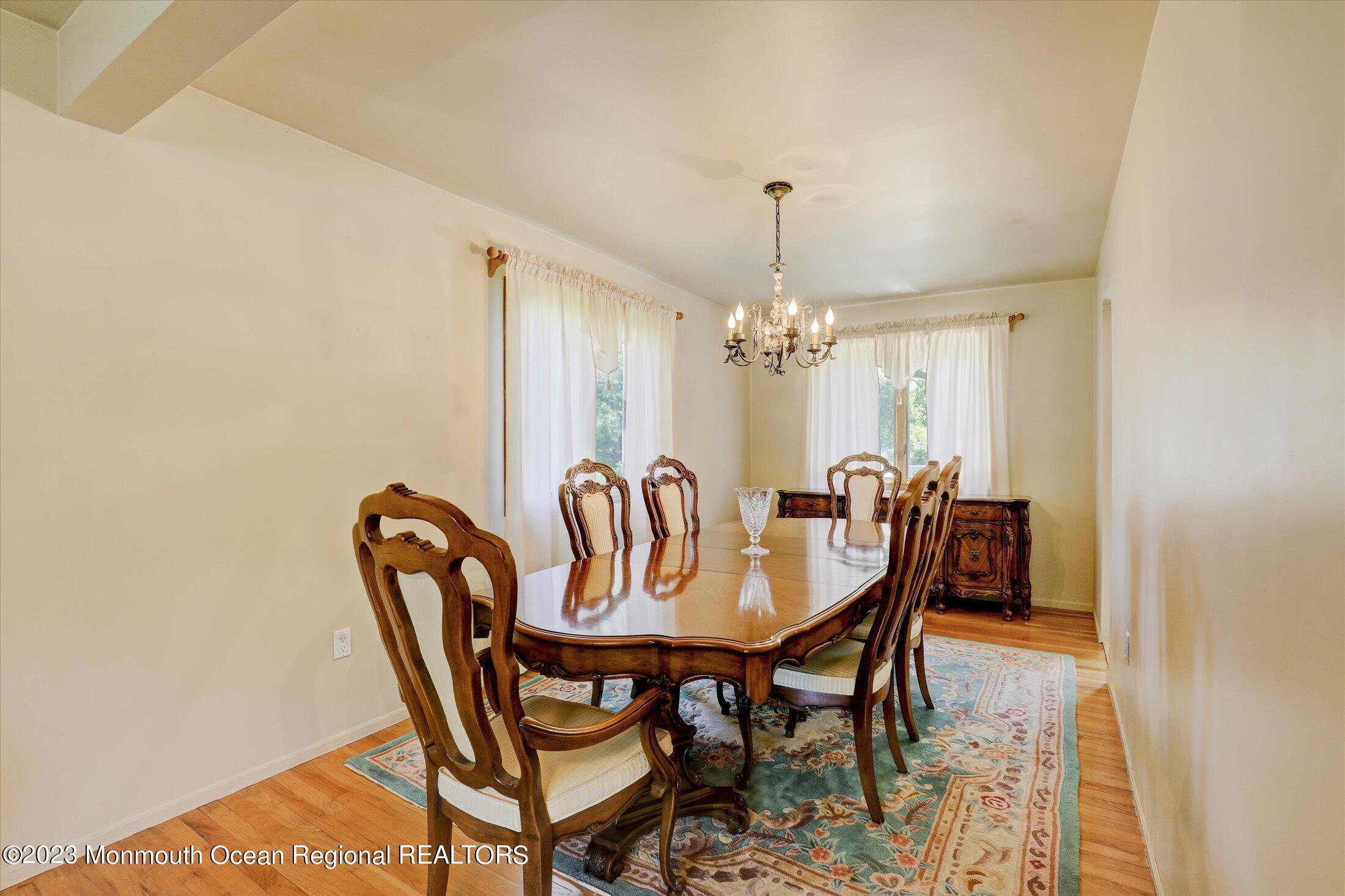 5 Ramble Way Hazlet, NJ 07730 - Photo 14 of 34 a view of a dining room with furniture and chandelier