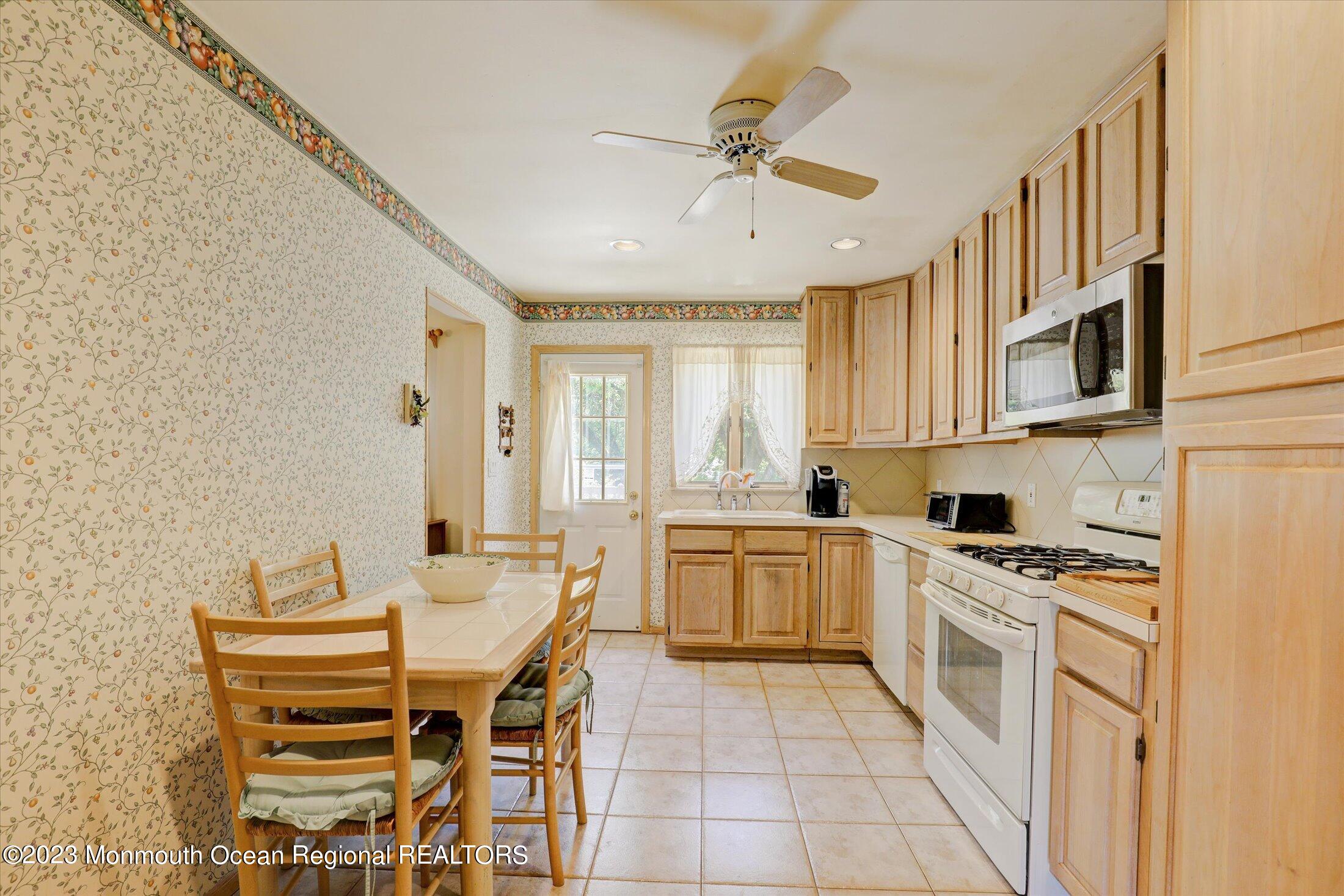 5 Ramble Way Hazlet, NJ 07730 - Photo 15 of 34 a kitchen with stainless steel appliances kitchen island granite countertop a sink and cabinets
