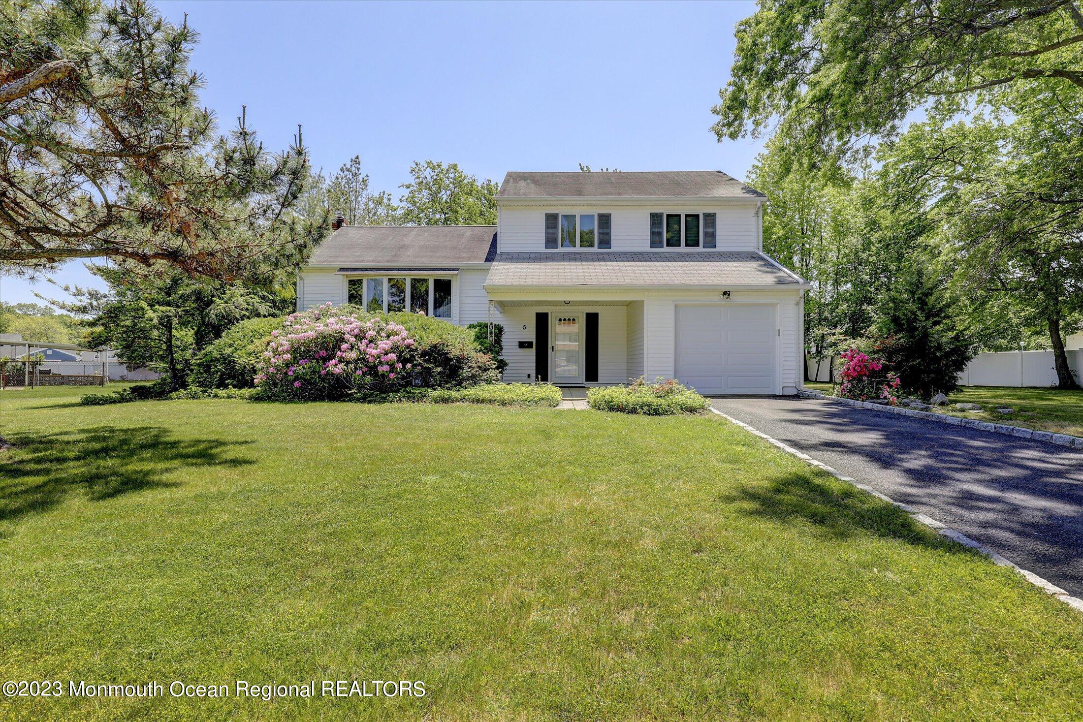 5 Ramble Way Hazlet, NJ 07730 - Photo 2 of 34 a front view of a house with garden