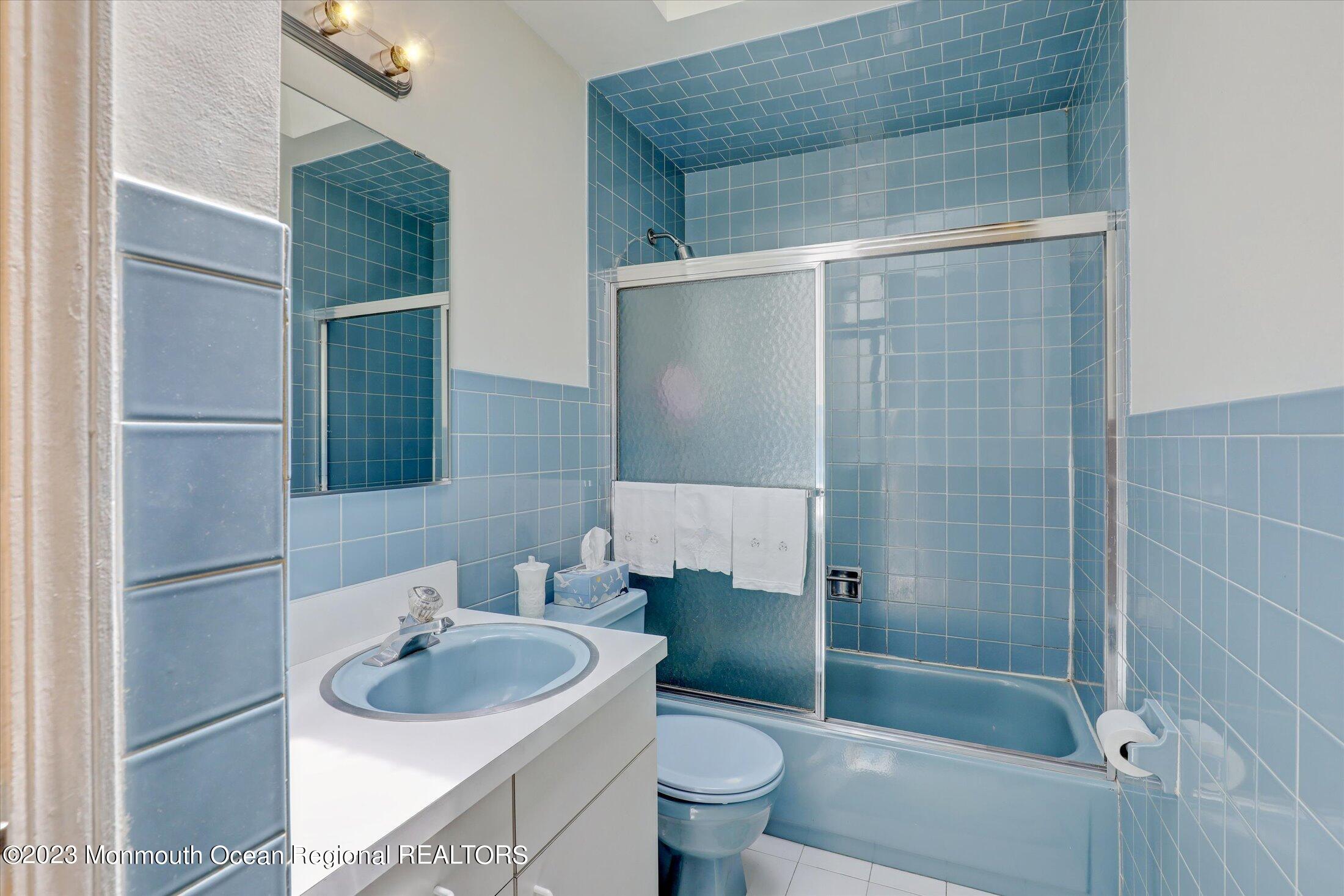 5 Ramble Way Hazlet, NJ 07730 - Photo 22 of 34 a bathroom with a sink and a mirror
