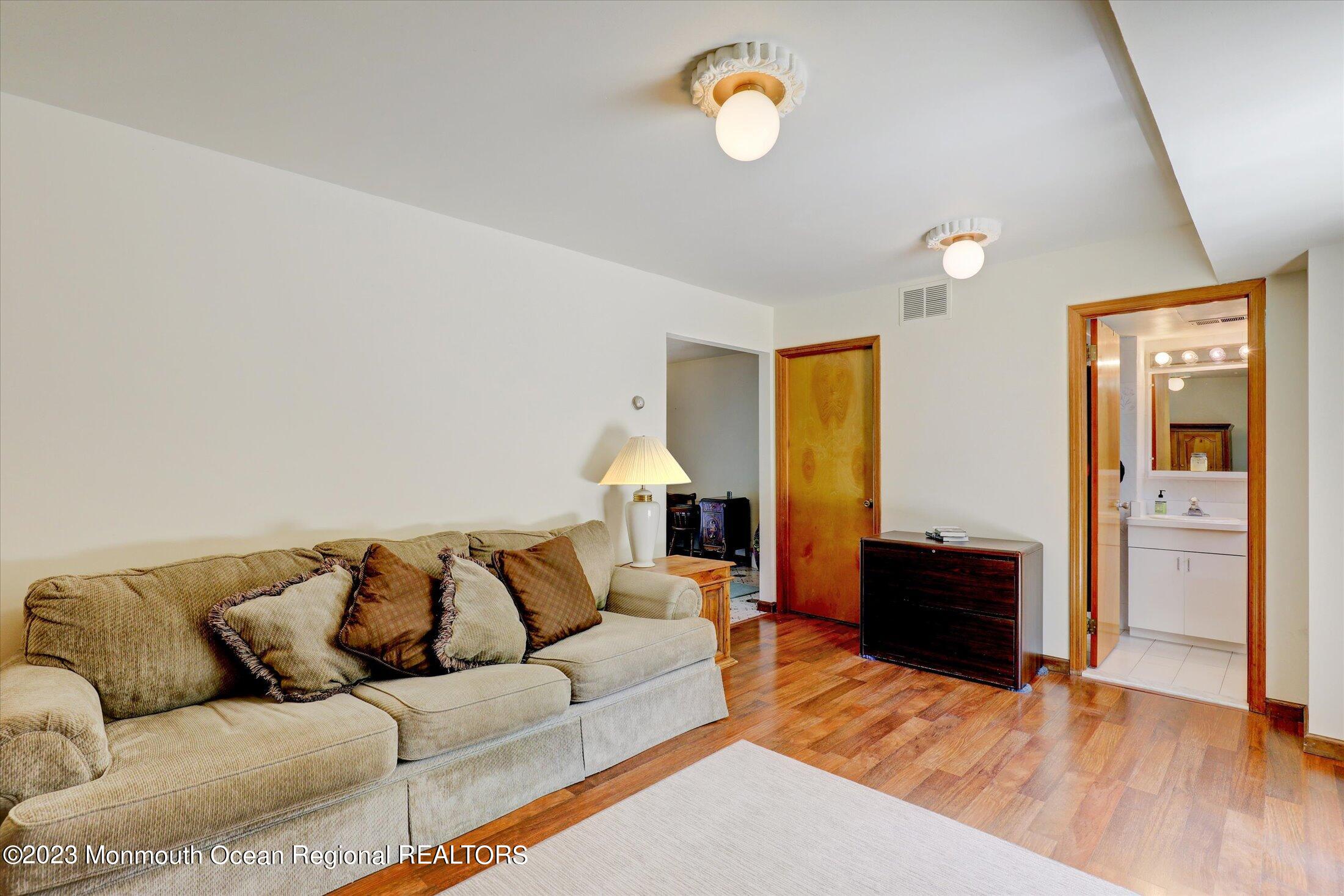 5 Ramble Way Hazlet, NJ 07730 - Photo 7 of 34 a living room with furniture and a flat screen tv