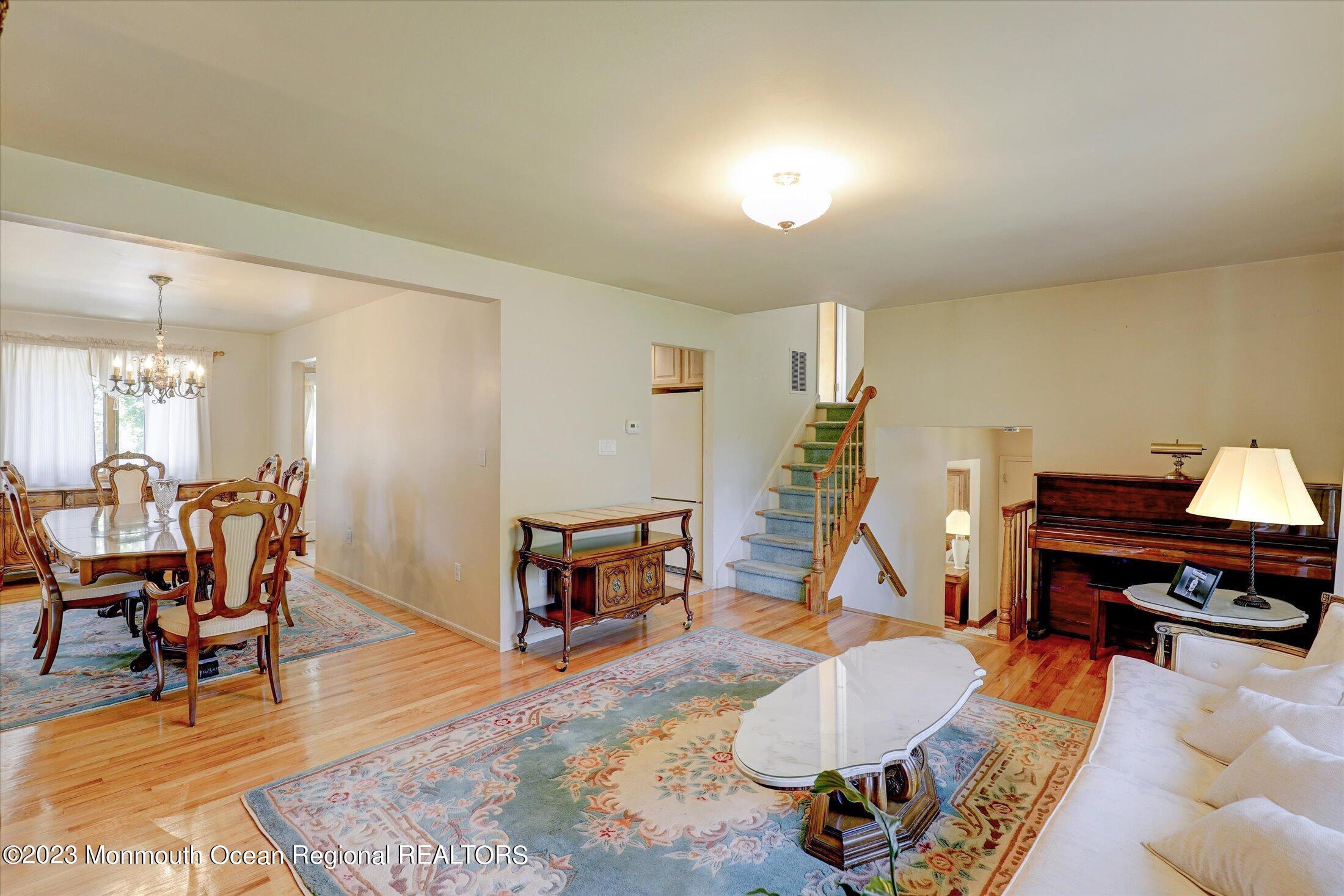 5 Ramble Way Hazlet, NJ 07730 - Photo 10 of 34 a living room with furniture a piano and wooden floor