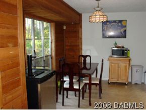 3505 Old Deland Road Daytona Beach, FL 32124 - Photo 3 of 10 a view of a dining room with furniture window and outside view