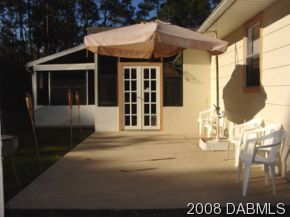 3505 Old Deland Road Daytona Beach, FL 32124 - Photo 6 of 10 a front view of a house with a garage