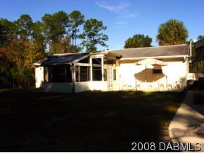 3505 Old Deland Road Daytona Beach, FL 32124 - Photo 7 of 10 a front view of a house with a yard