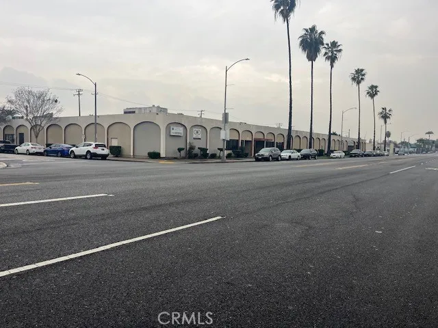 a view of a house with a small yard and plants