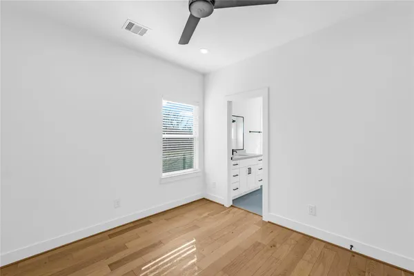 an empty room with a empty space and windows