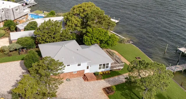 a view of a swimming pool with outdoor seating and yard