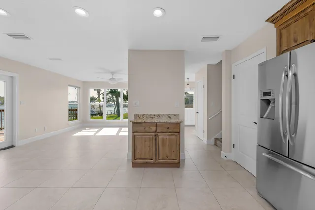 a kitchen with stainless steel appliances a refrigerator and a stove top oven